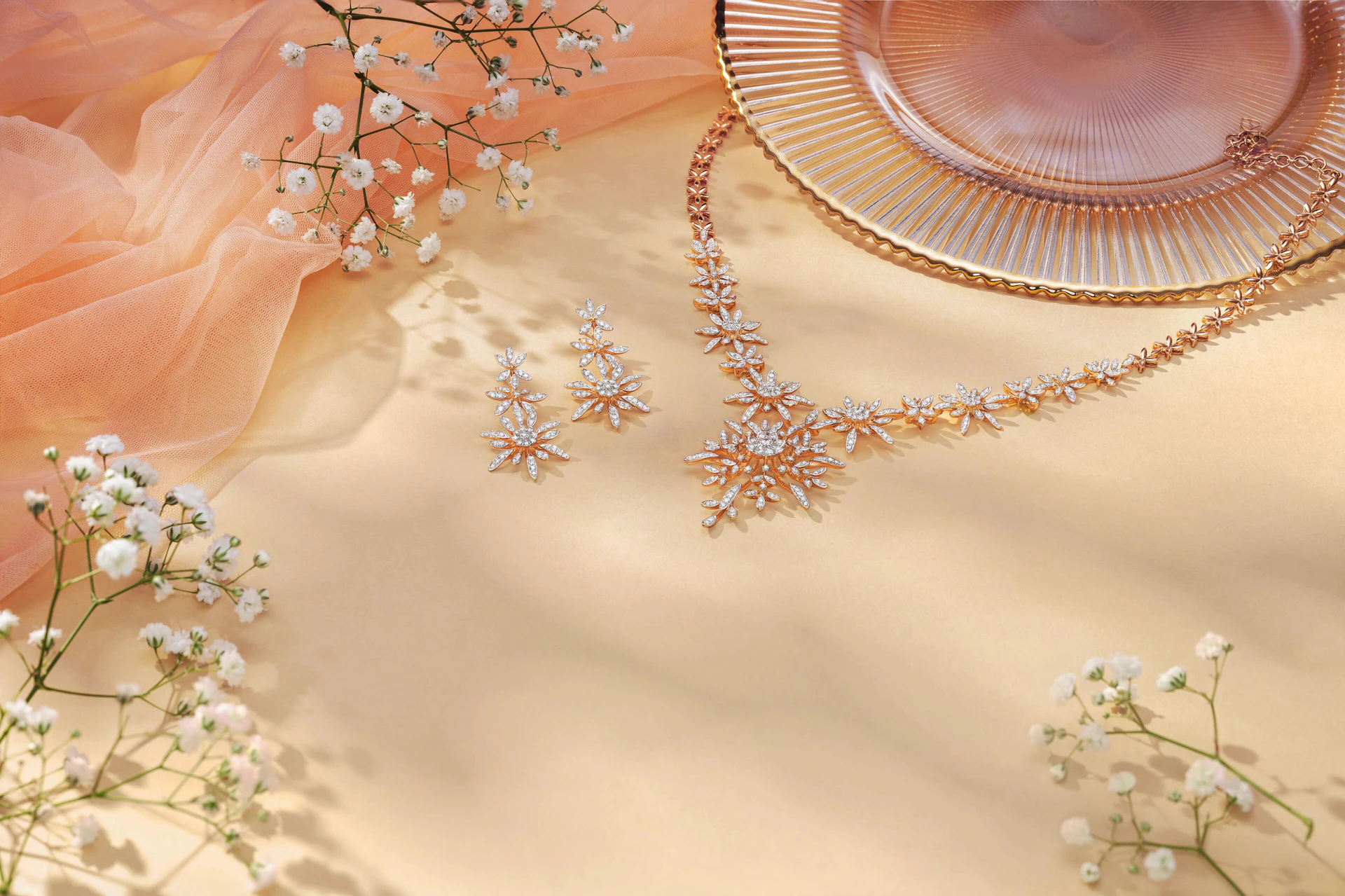Sparkling diamond necklace and earrings with delicate flowers.