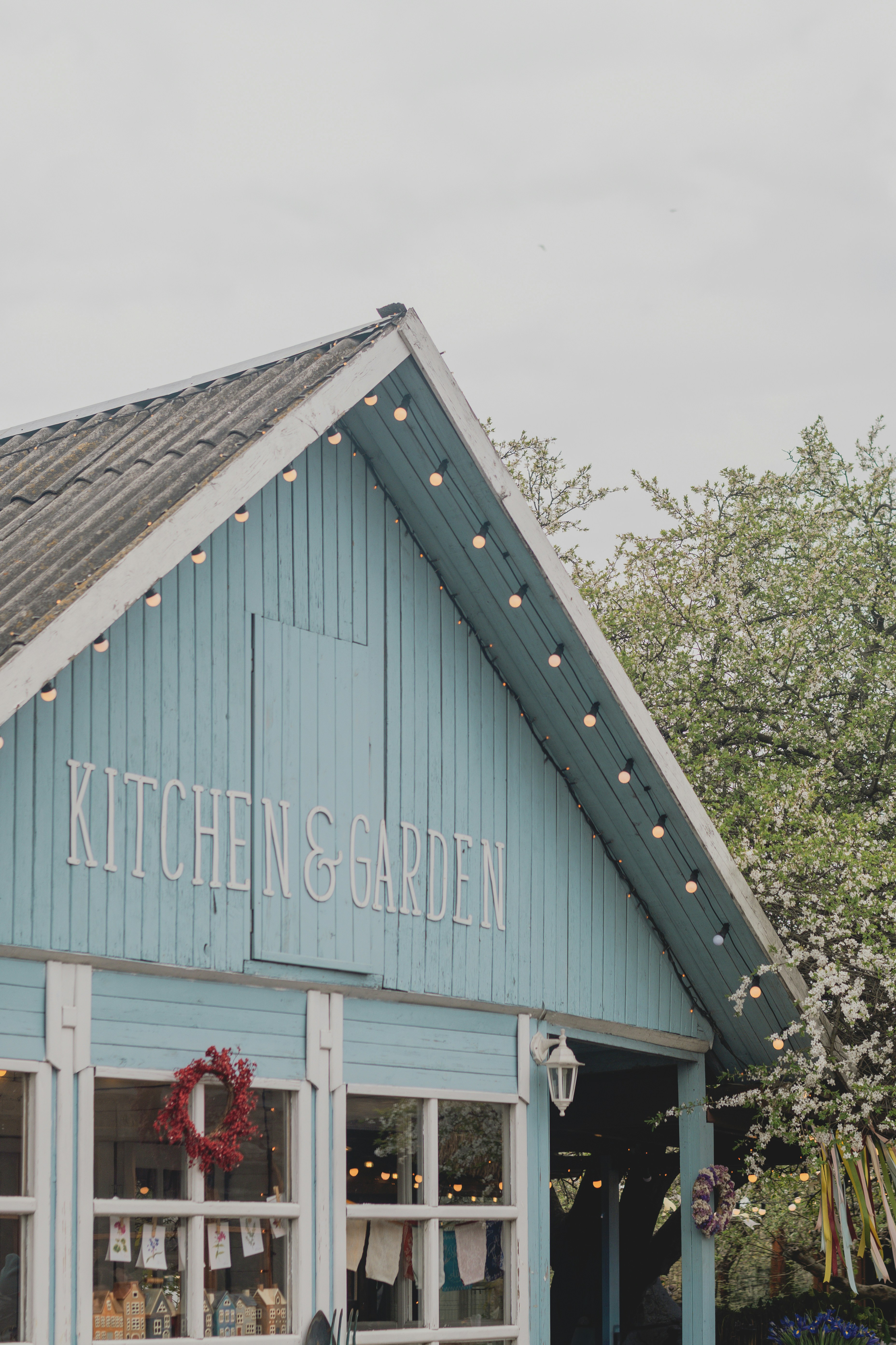 Light blue building with "kitchen & garden" sign