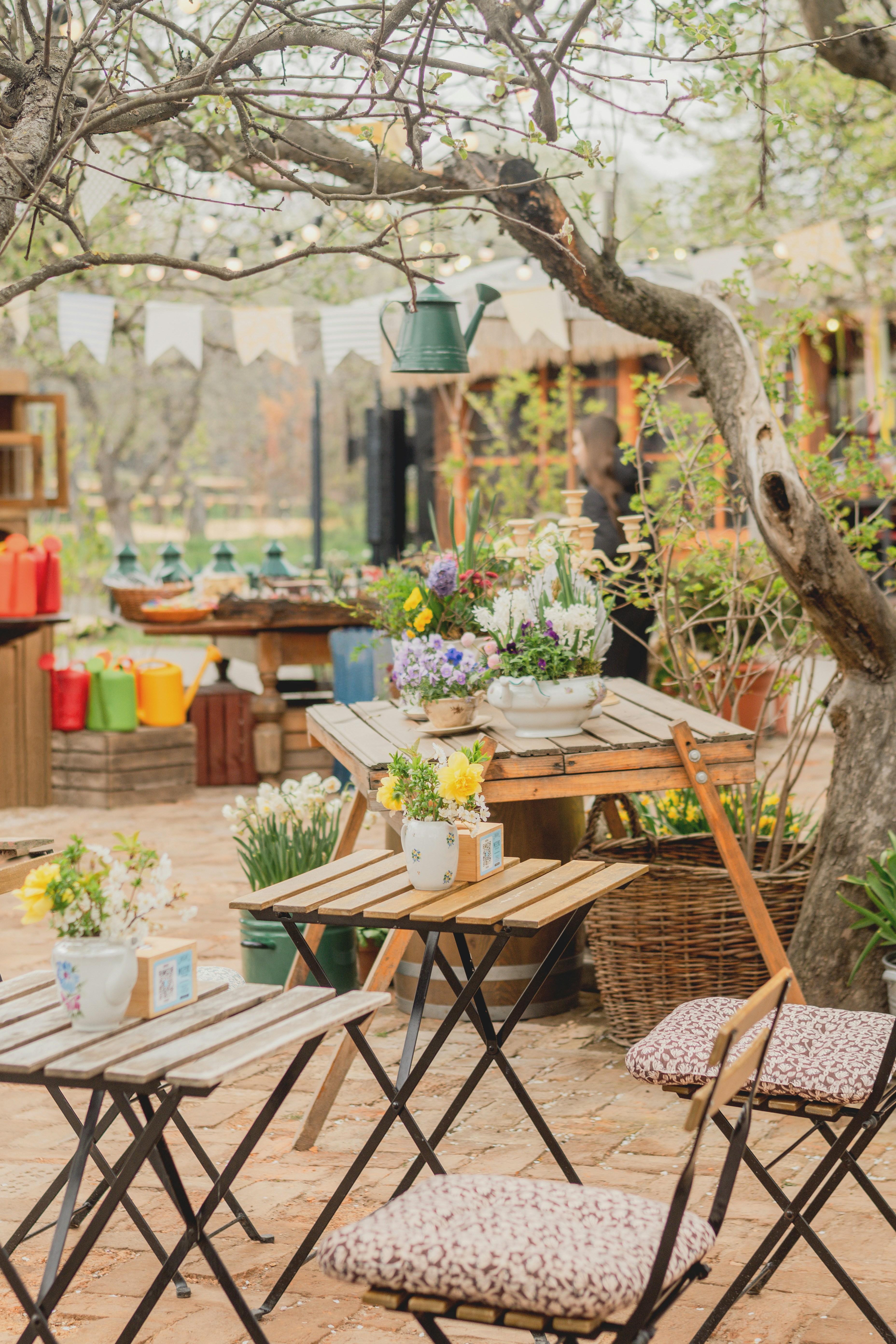Outdoor cafe tables decorated with spring flowers