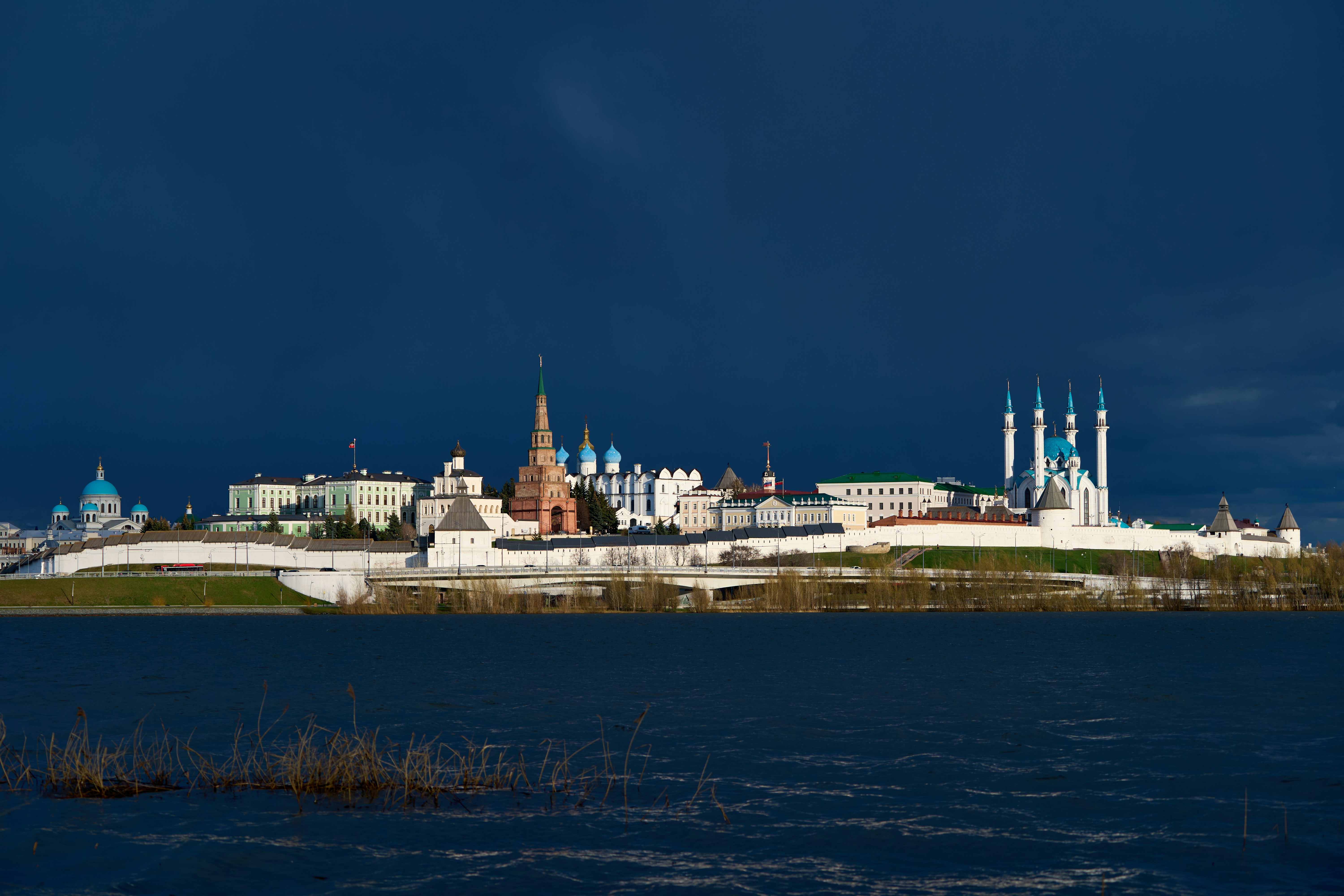 Historic fortress complex on a hill overlooking water.