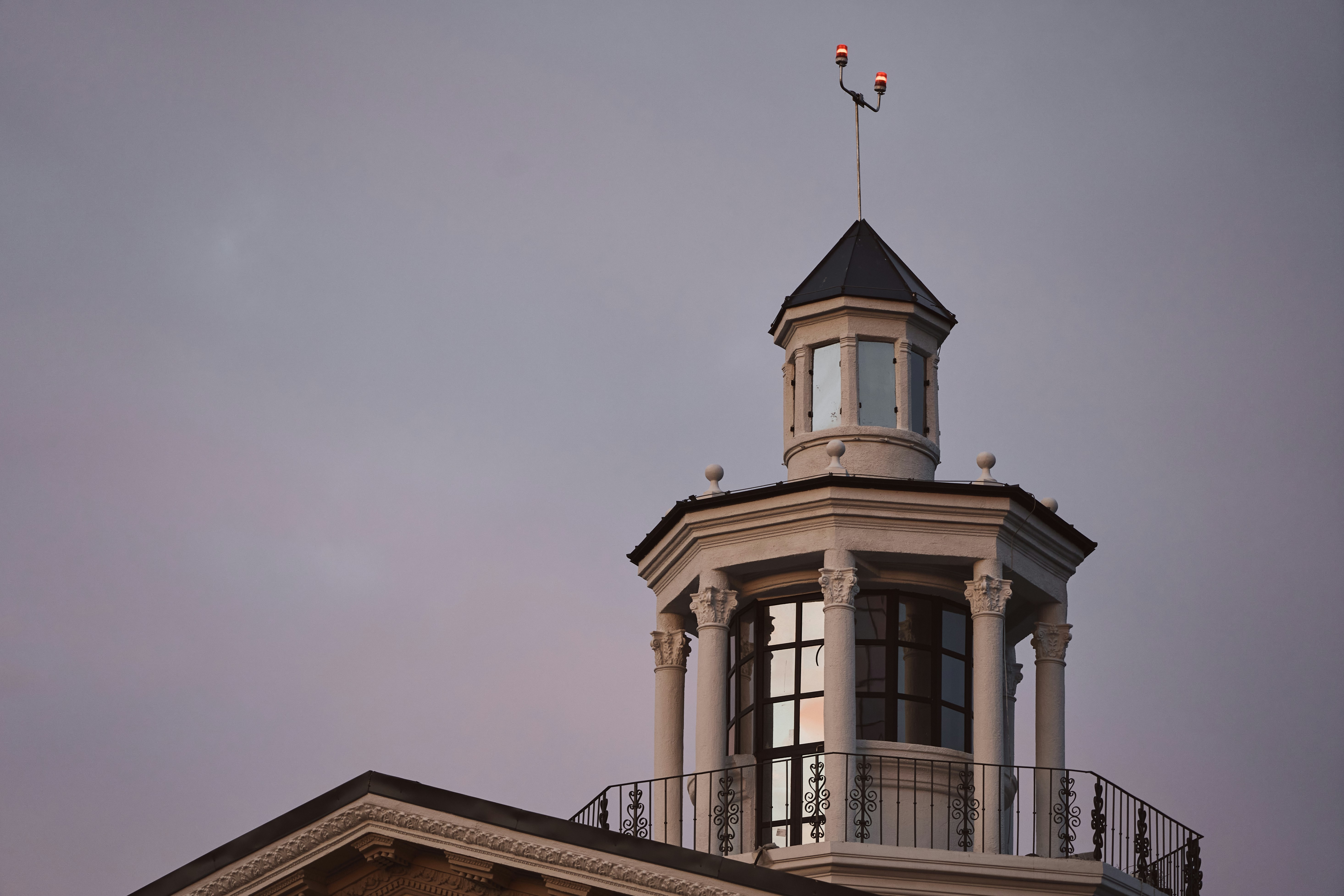 Close-up of a building's cupola against a twilight sky.