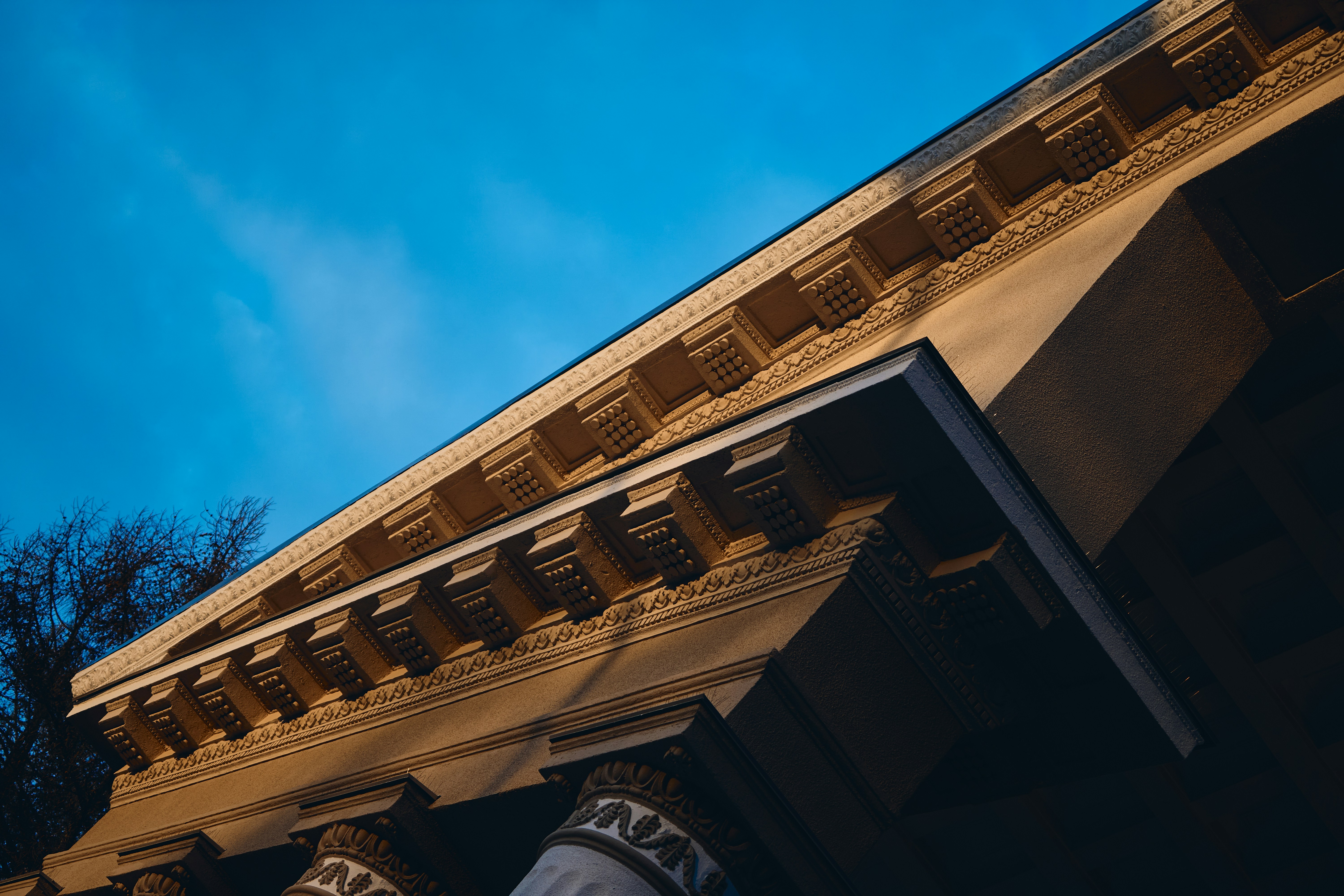 Architectural detail of a building against blue sky