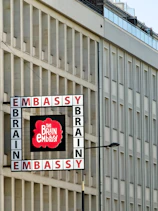 Embassy brain building exterior with a sign.