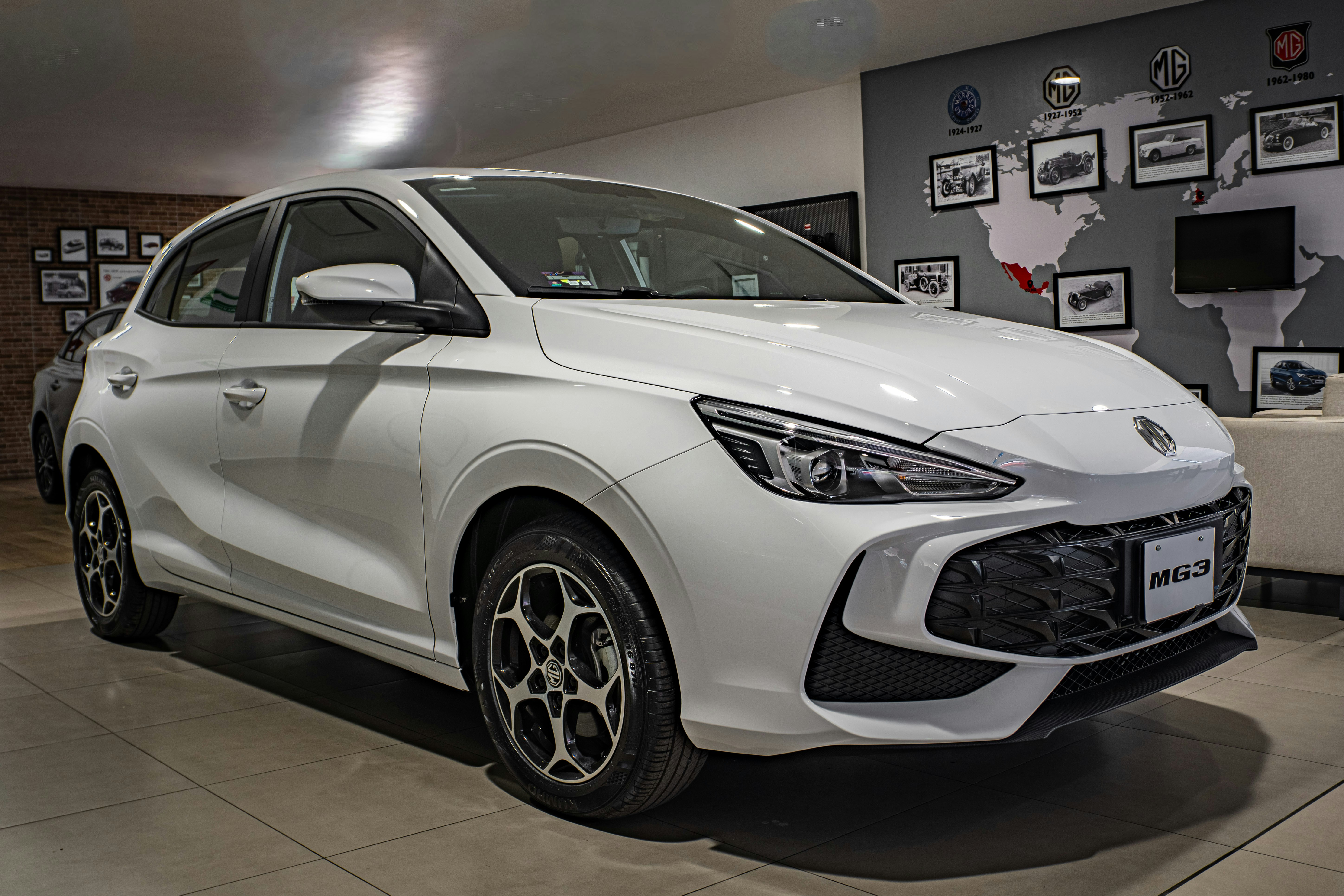 A white car parked inside a showroom