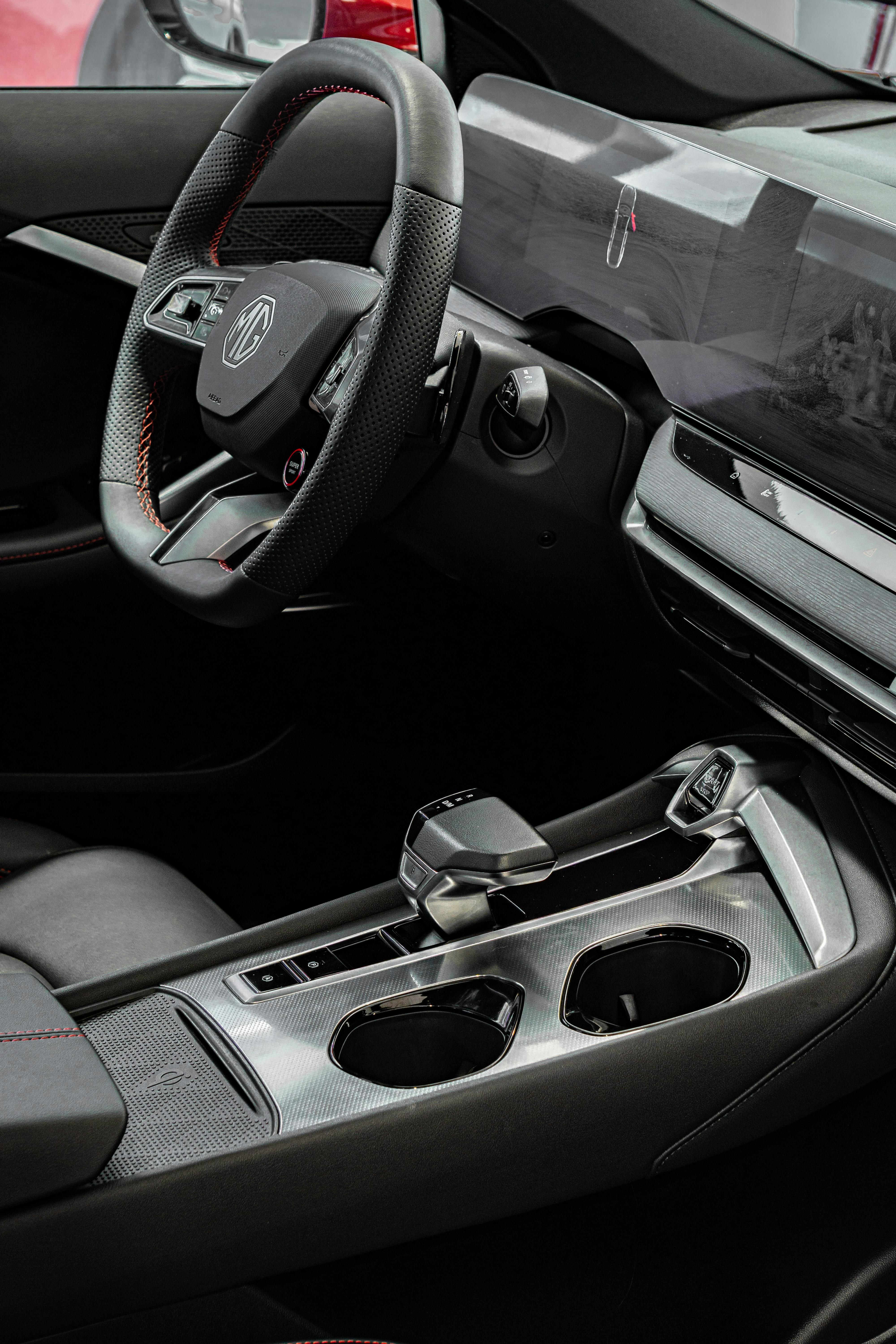 Modern car interior with steering wheel and console