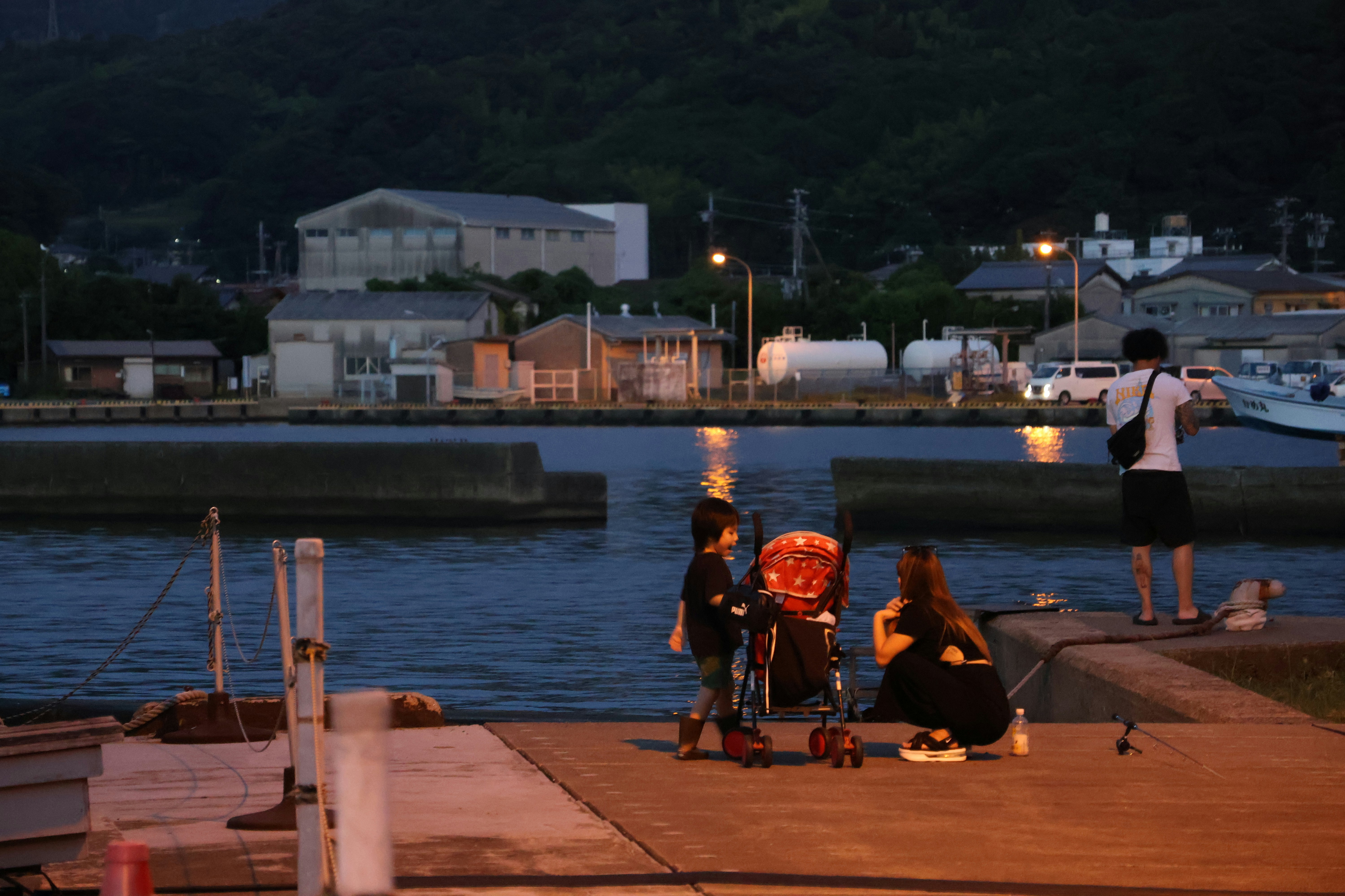 Japanese fishing village harbor with traditional boats