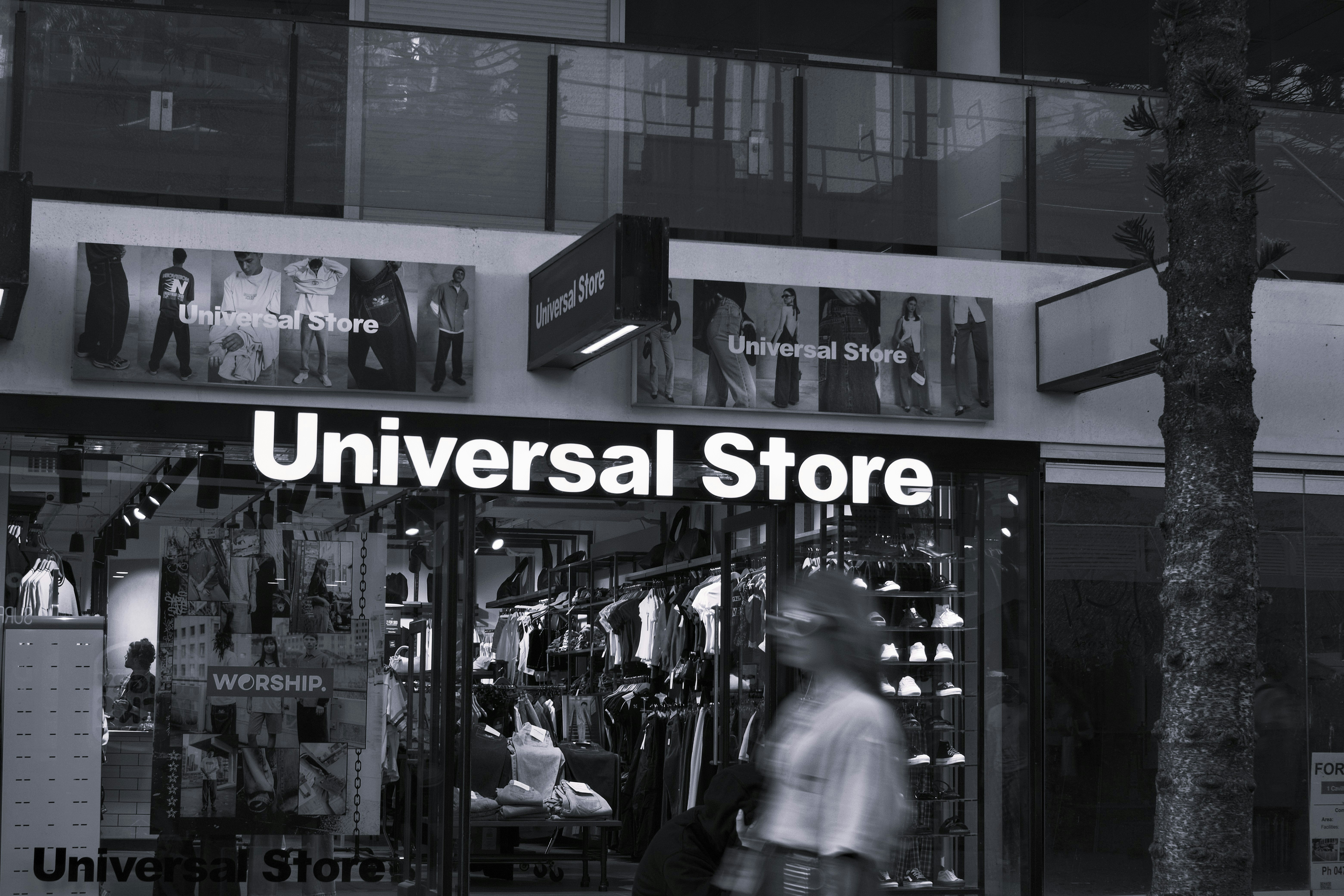 A universal storefront with mannequins displayed.