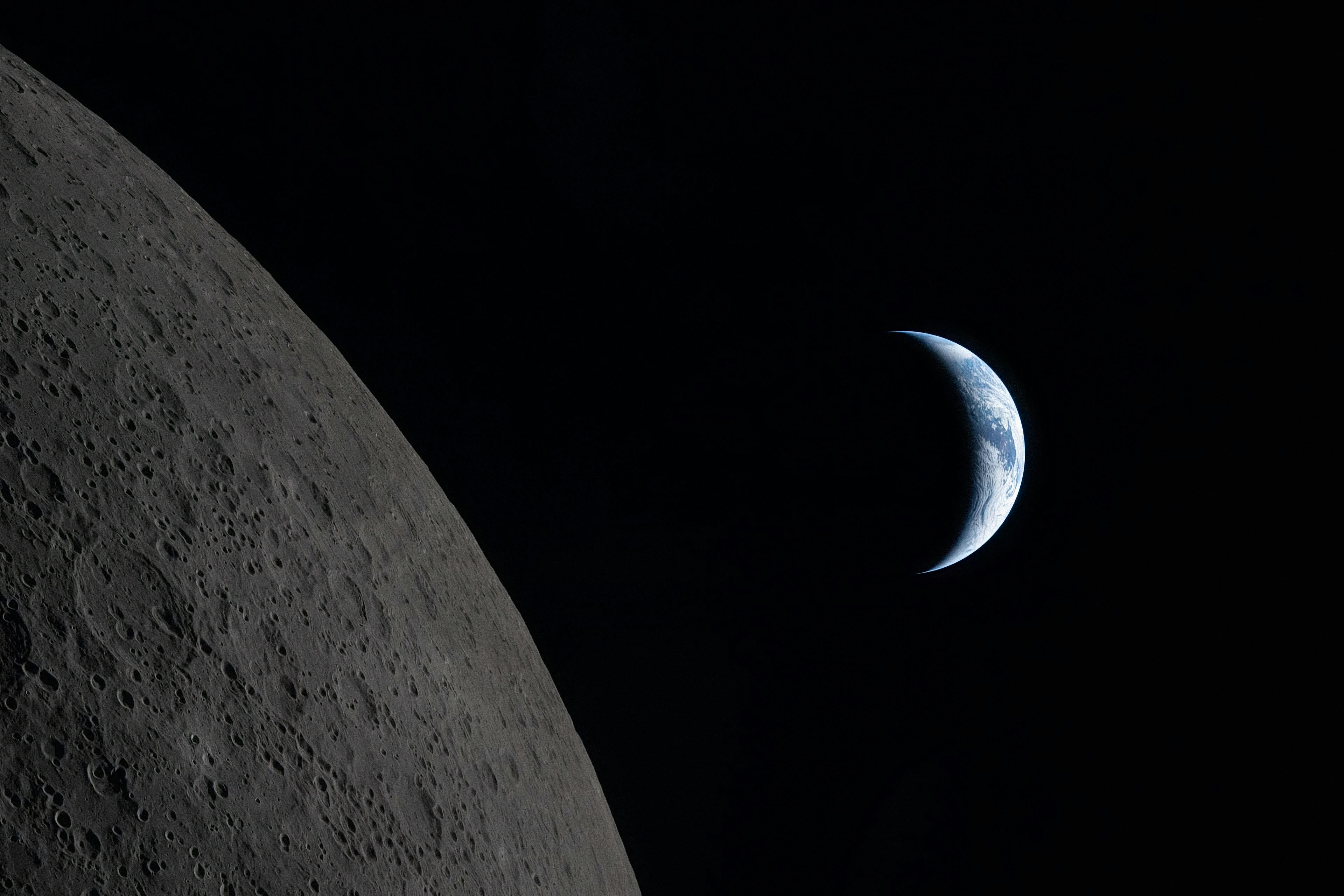 Crescent earth seen from the moon's surface