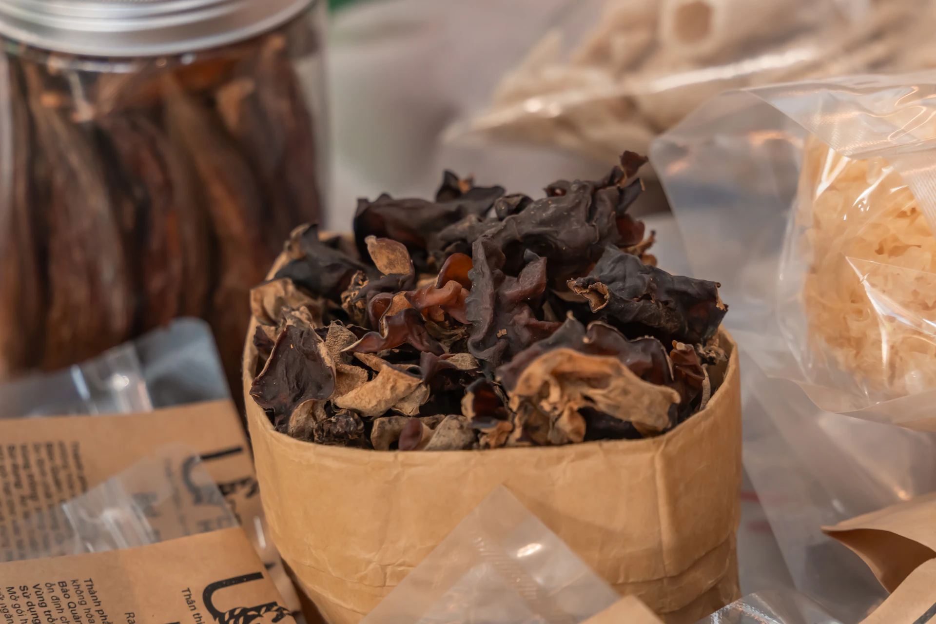 Dried mushrooms in a small paper bag.