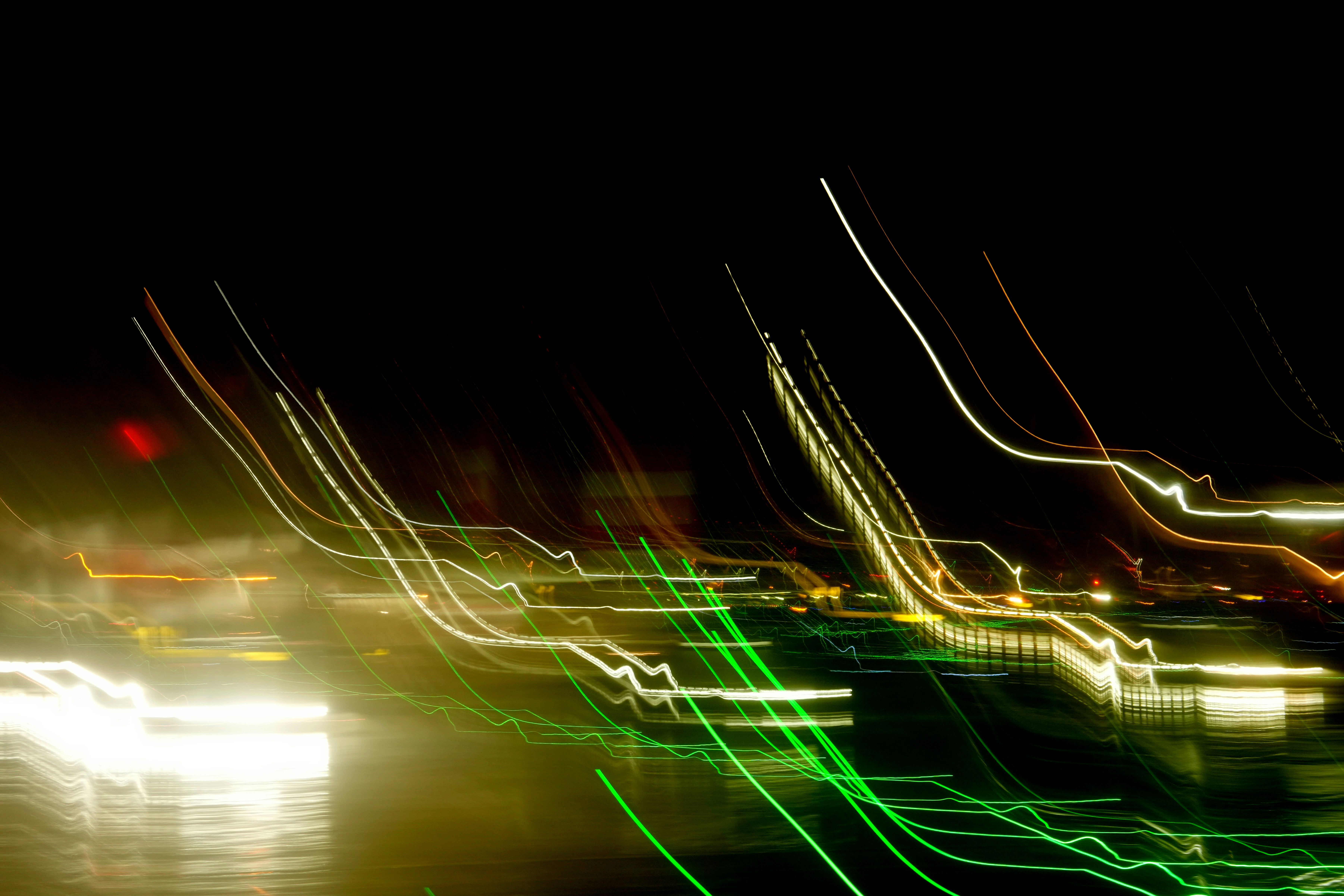 Abstract streaks of light blur across dark background