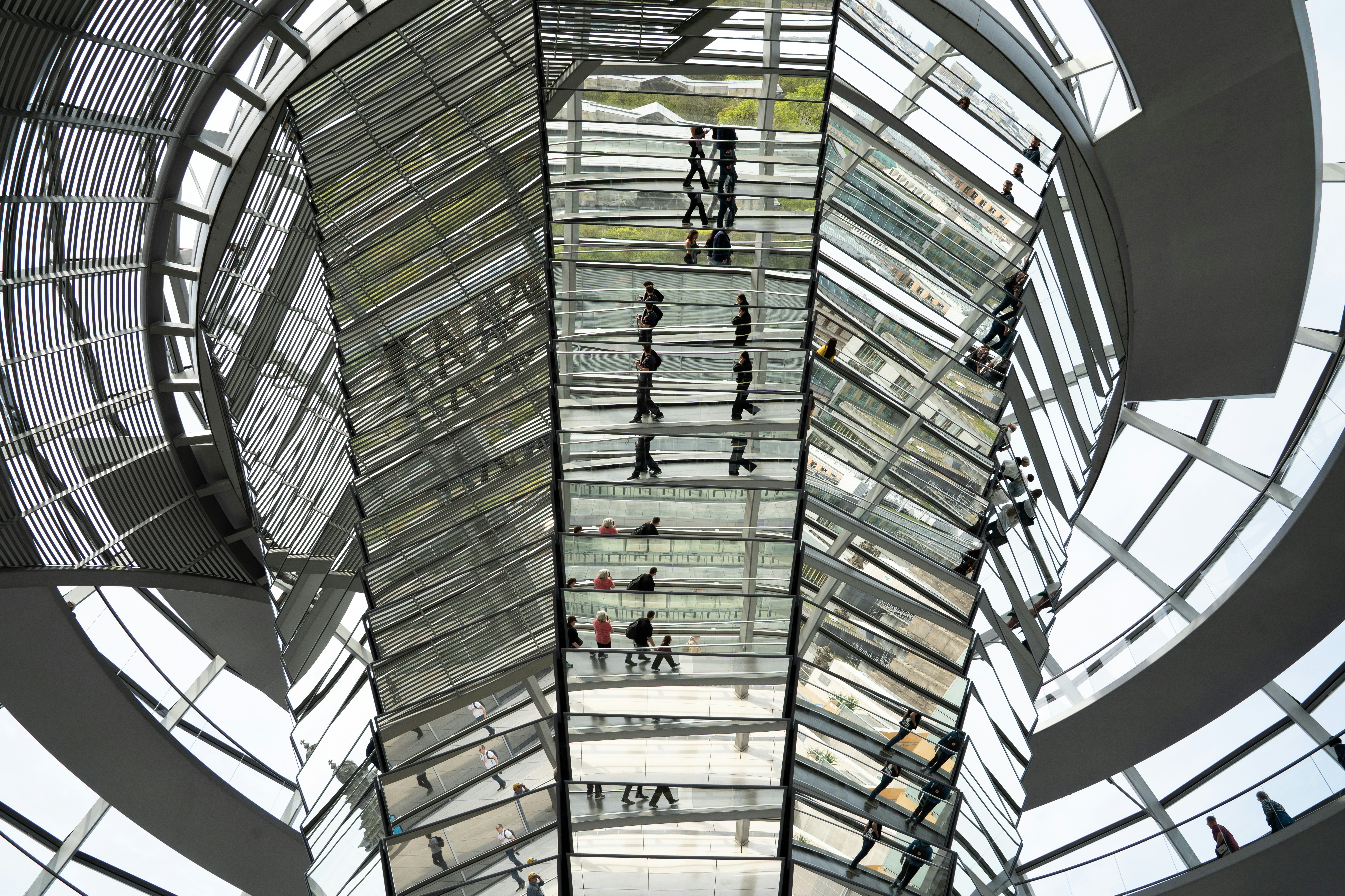 Modern glass dome interior with people walking