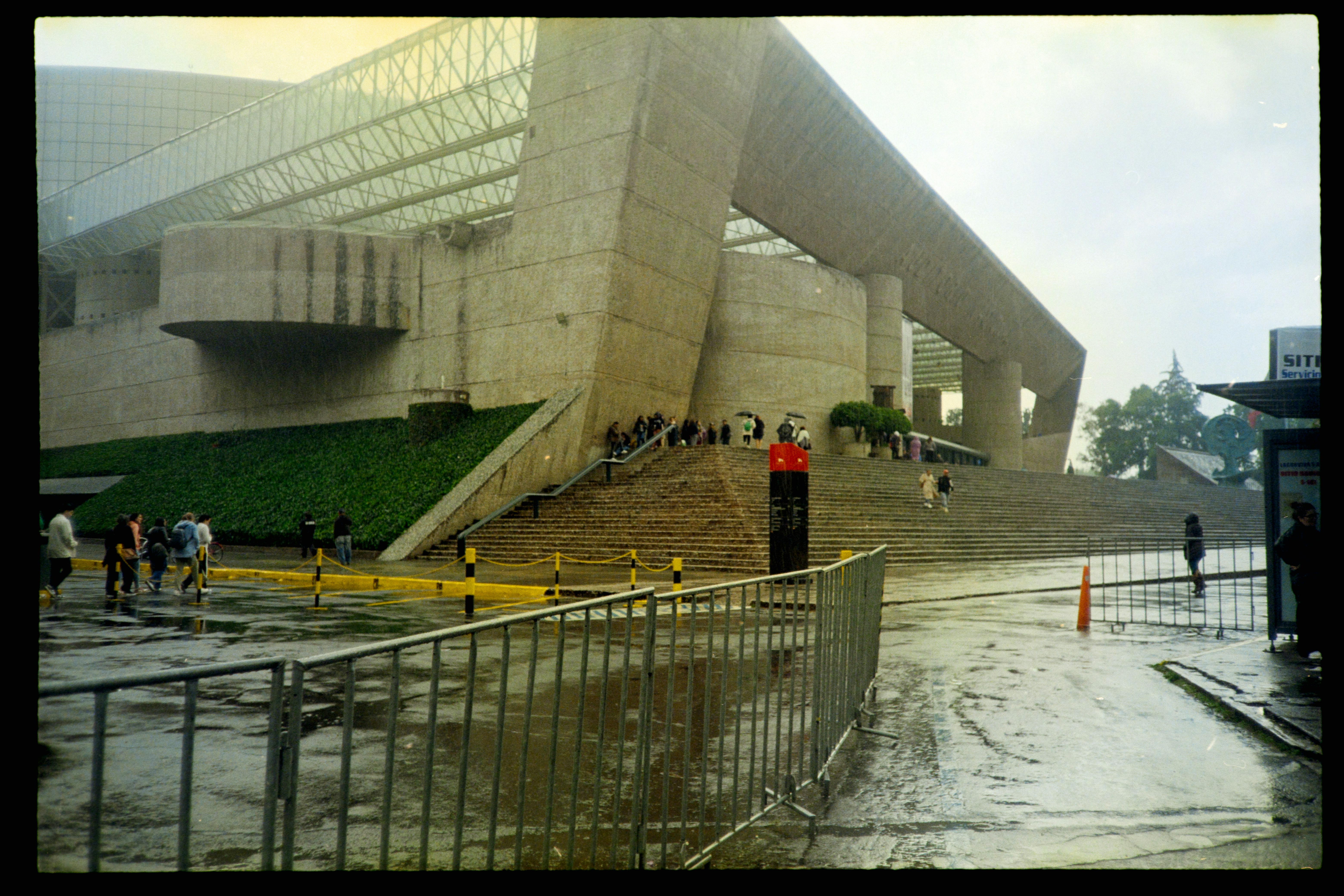Modern concrete building with glass roof and stairs