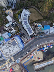 Aerial view of coastal town with boats and buildings