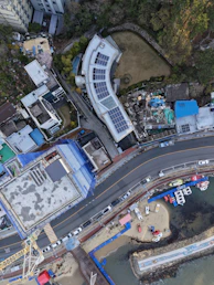 Aerial view of coastal town with boats and buildings