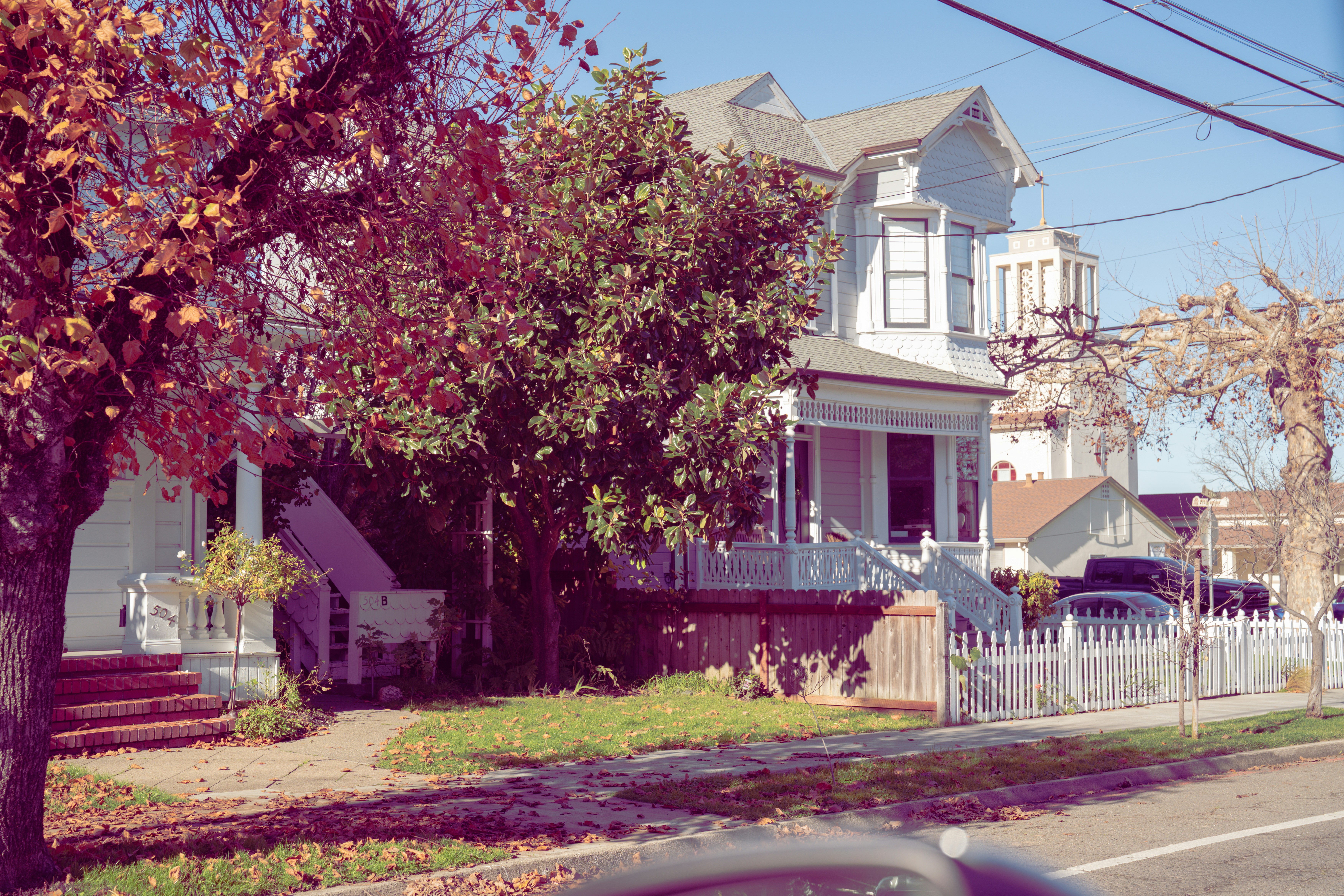 Victorian house with a white picket fence.