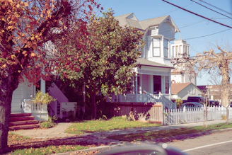 Victorian house with a white picket fence.