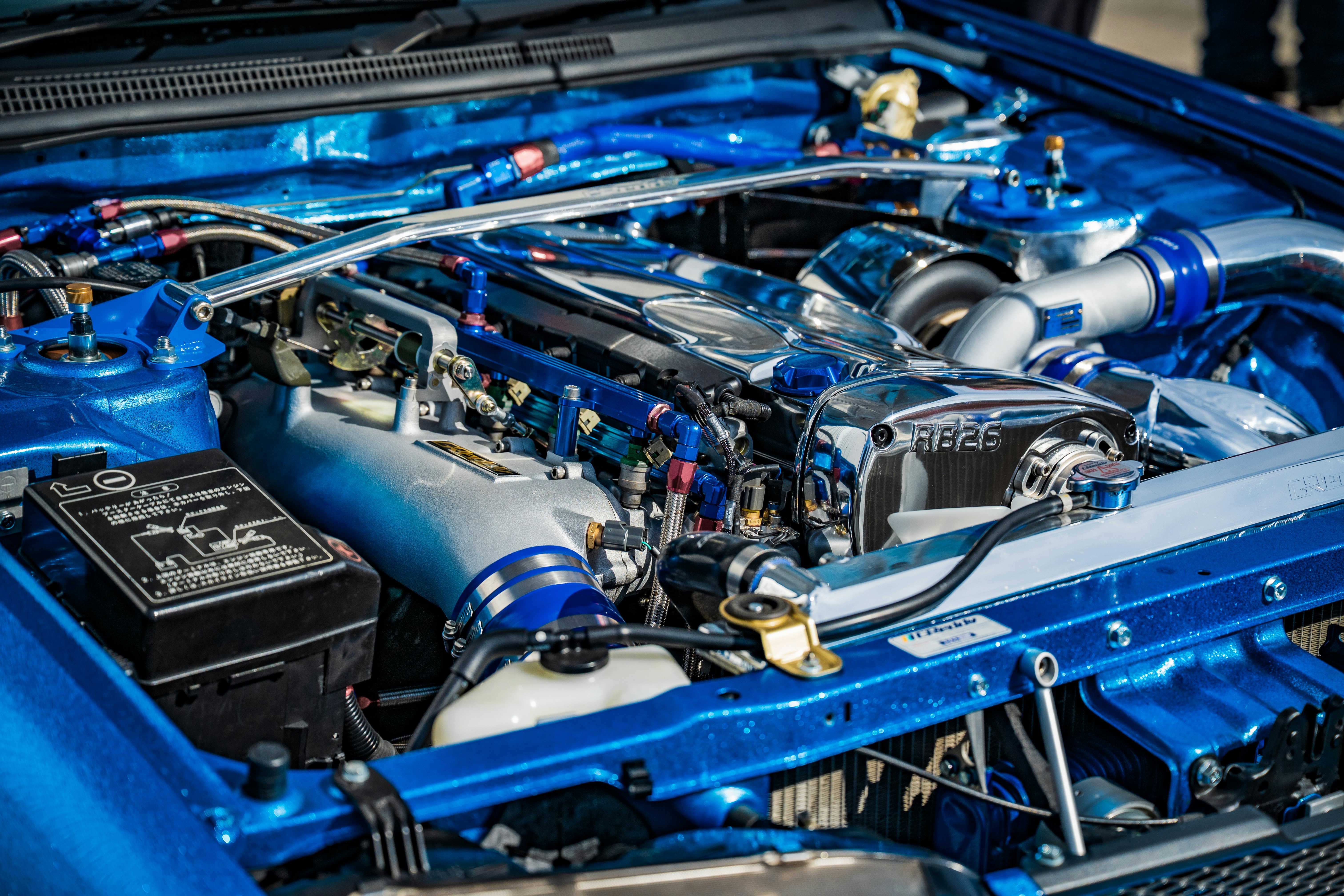 Detailed view of a modified blue car engine