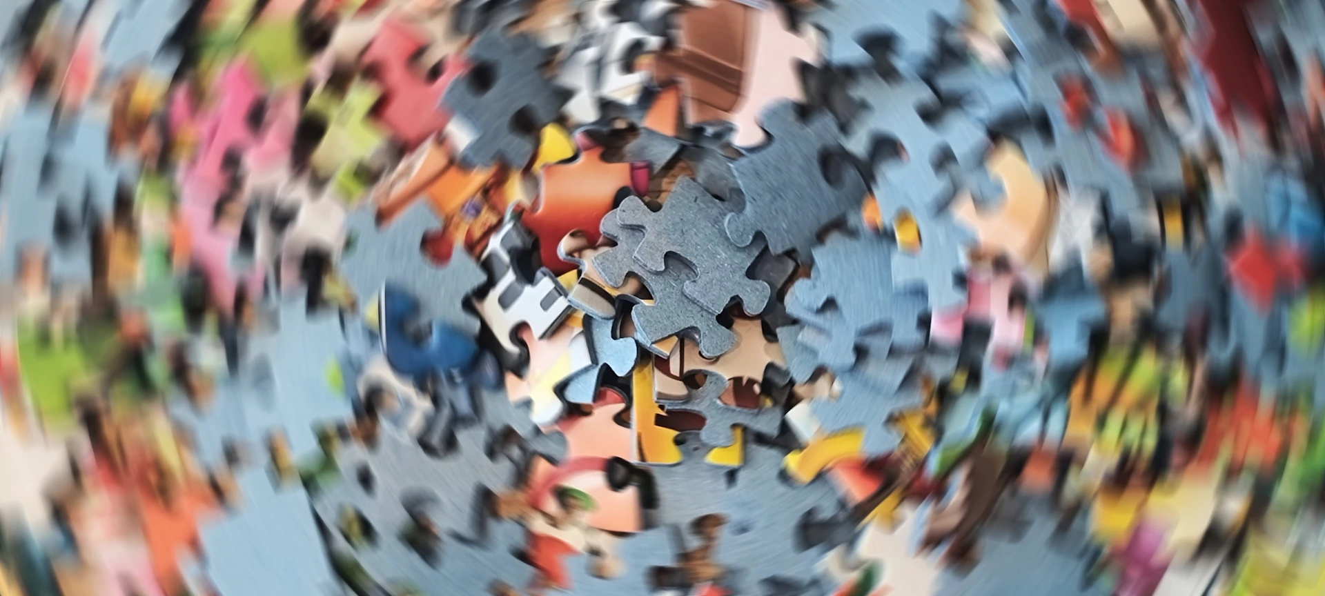 Scattered colorful puzzle pieces with motion blur effect
