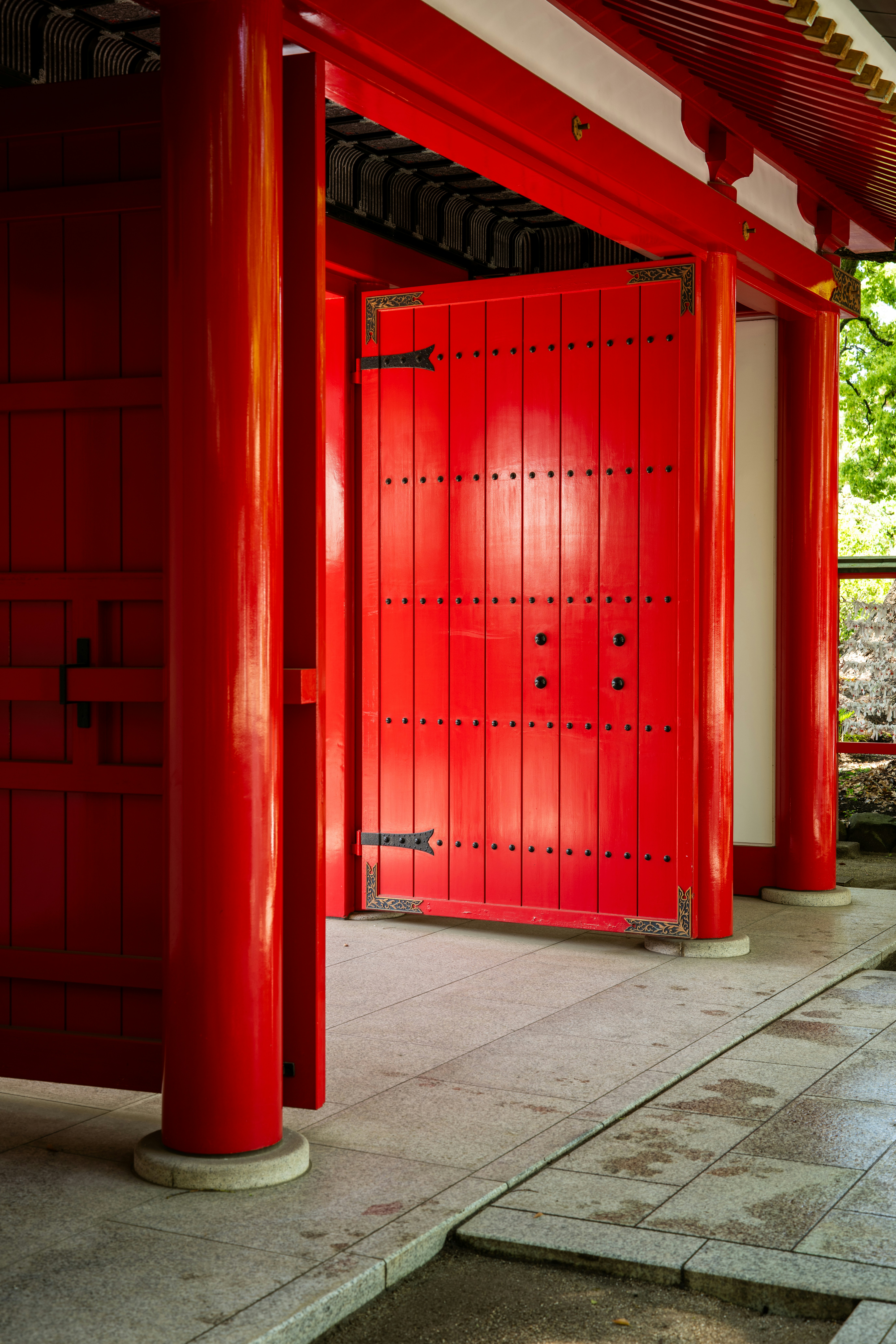 Bright red wooden doors of a traditional japanese building.
