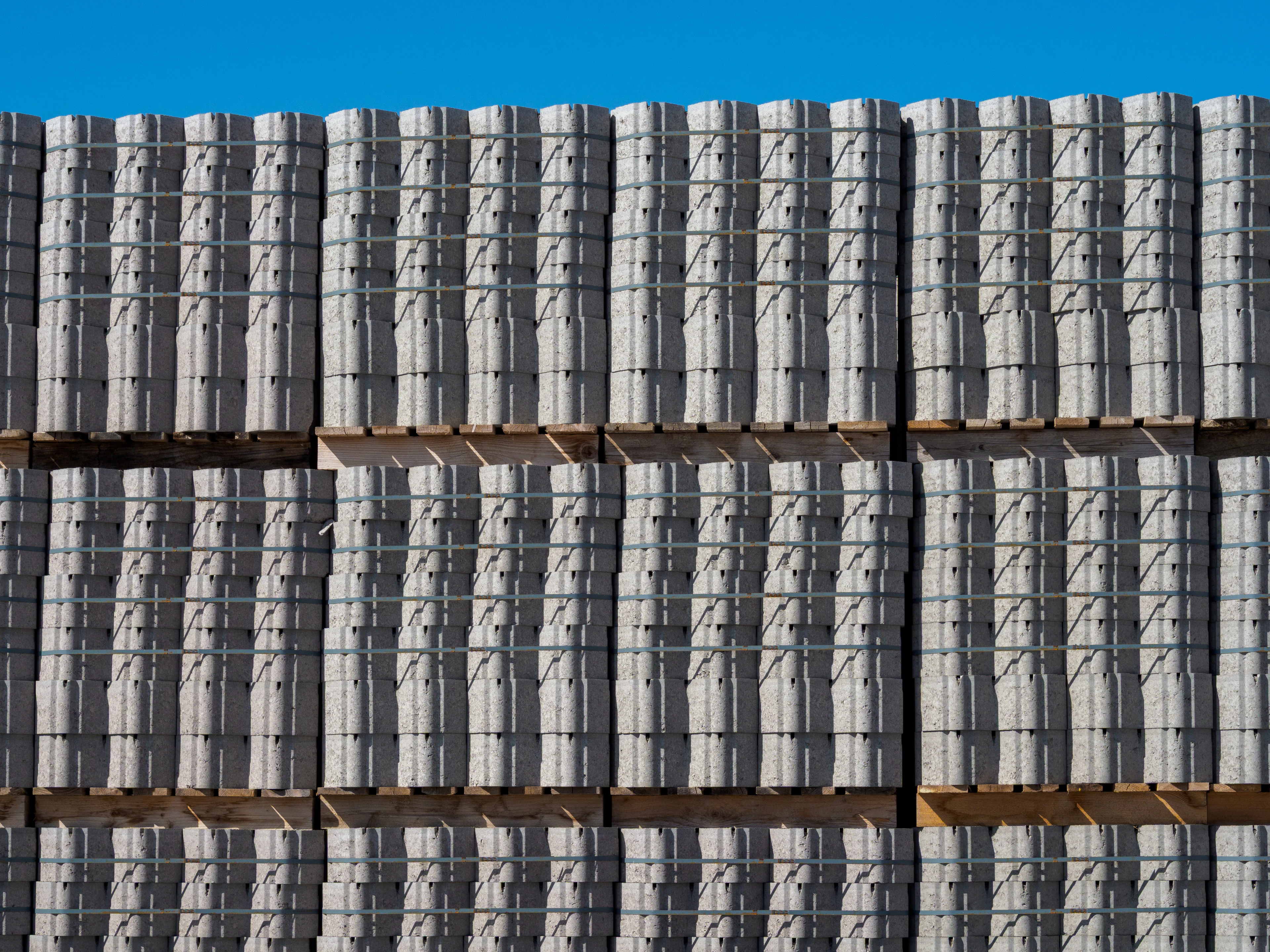 Pallets of paver blocks staged on site