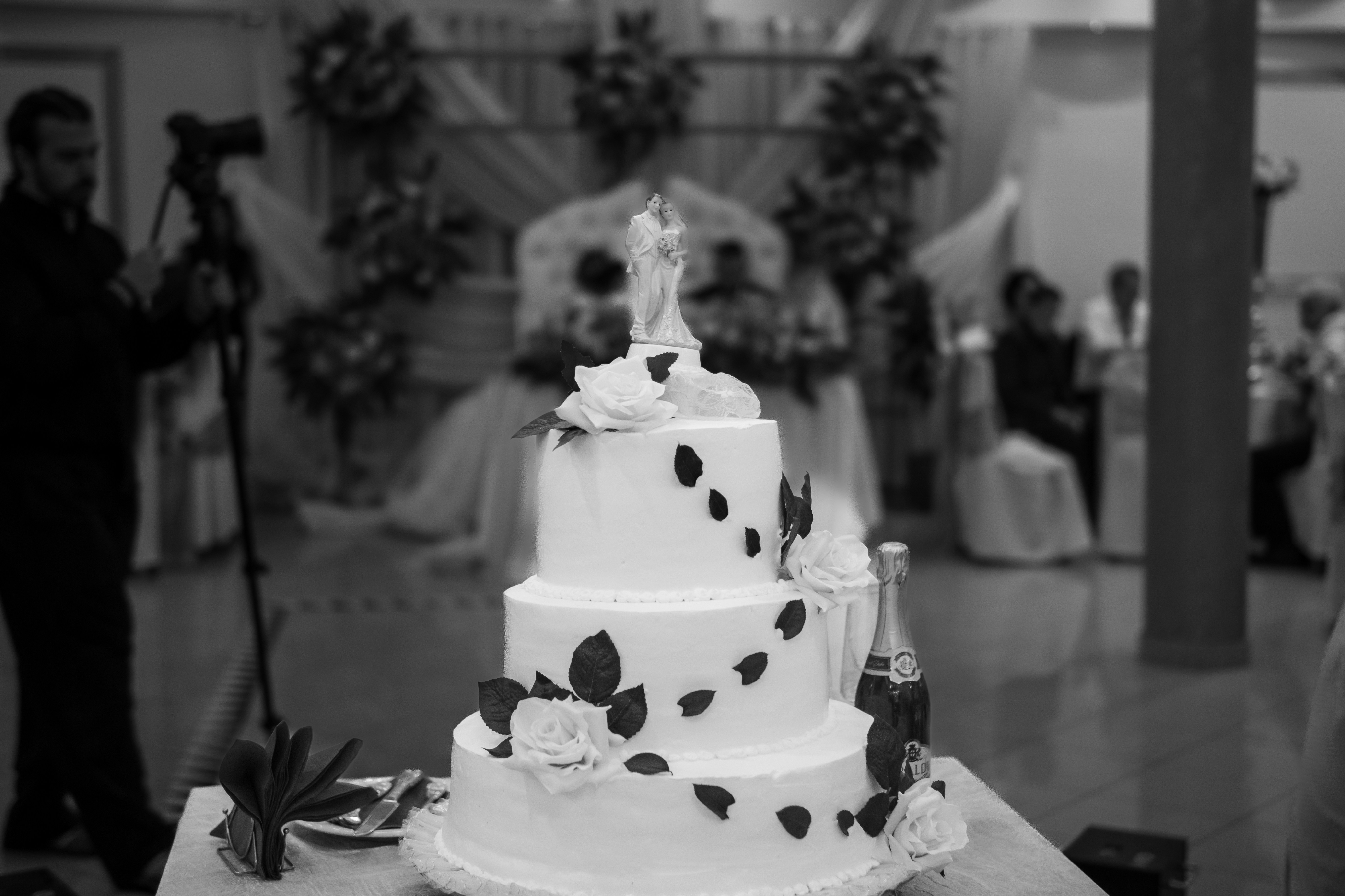 Tiered wedding cake with topper