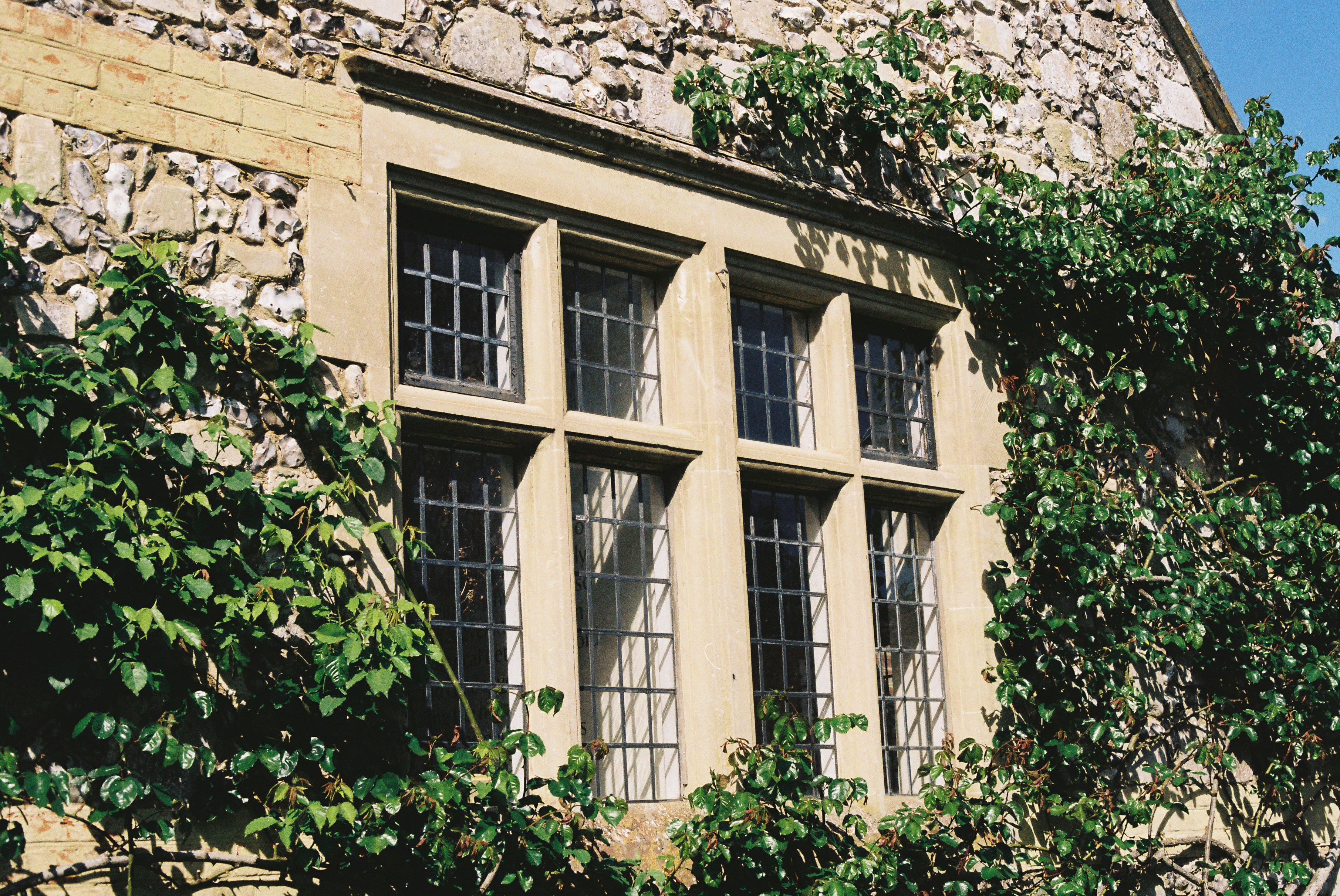 Large multi-pane window on a stone facade
