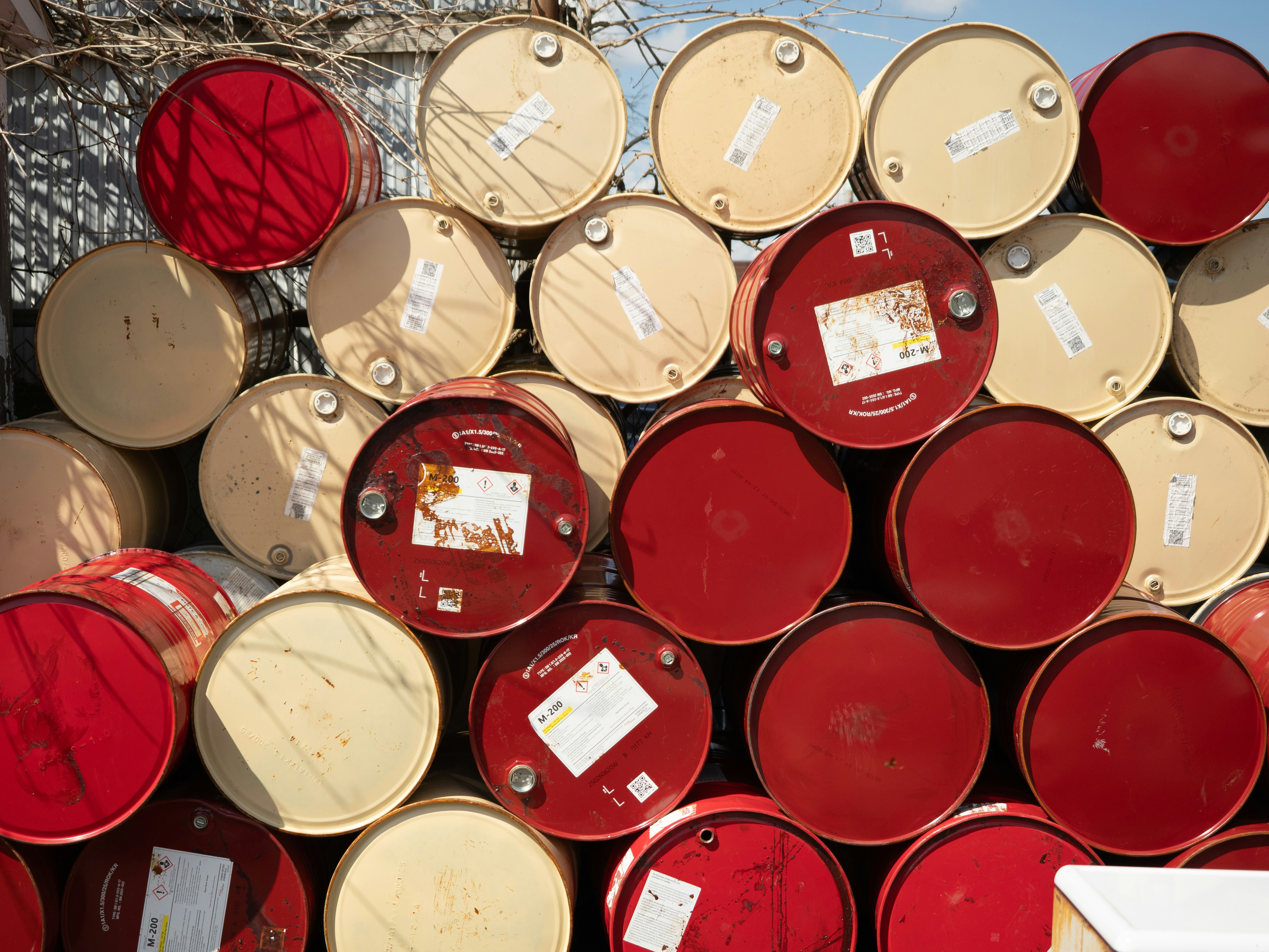 Stack of red and beige metal drums