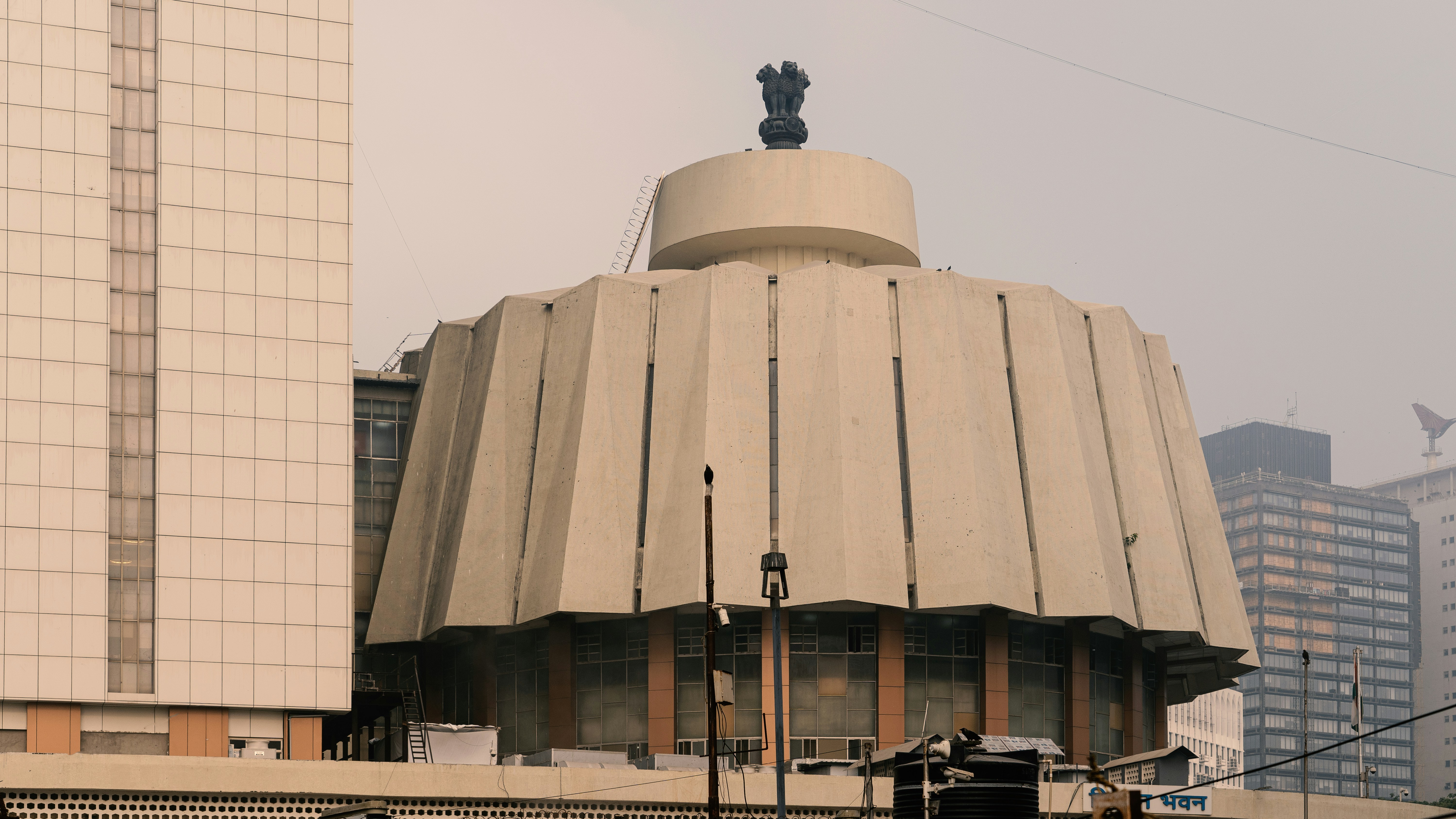 A balanced scale with symbols of Parliament, Gavel, and Indian Emblem, representing the three pillars of Indian democracy working in harmony.