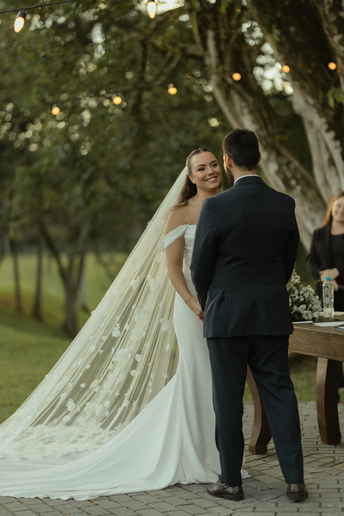 How to write personalized wedding vows examples — A bride reads heartfelt promises from a handwritten note.