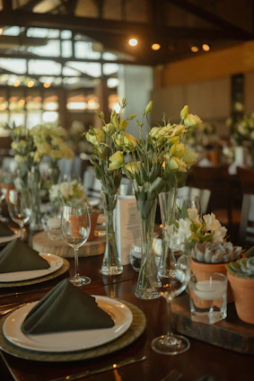 Table setting with floral arrangements and succulents
