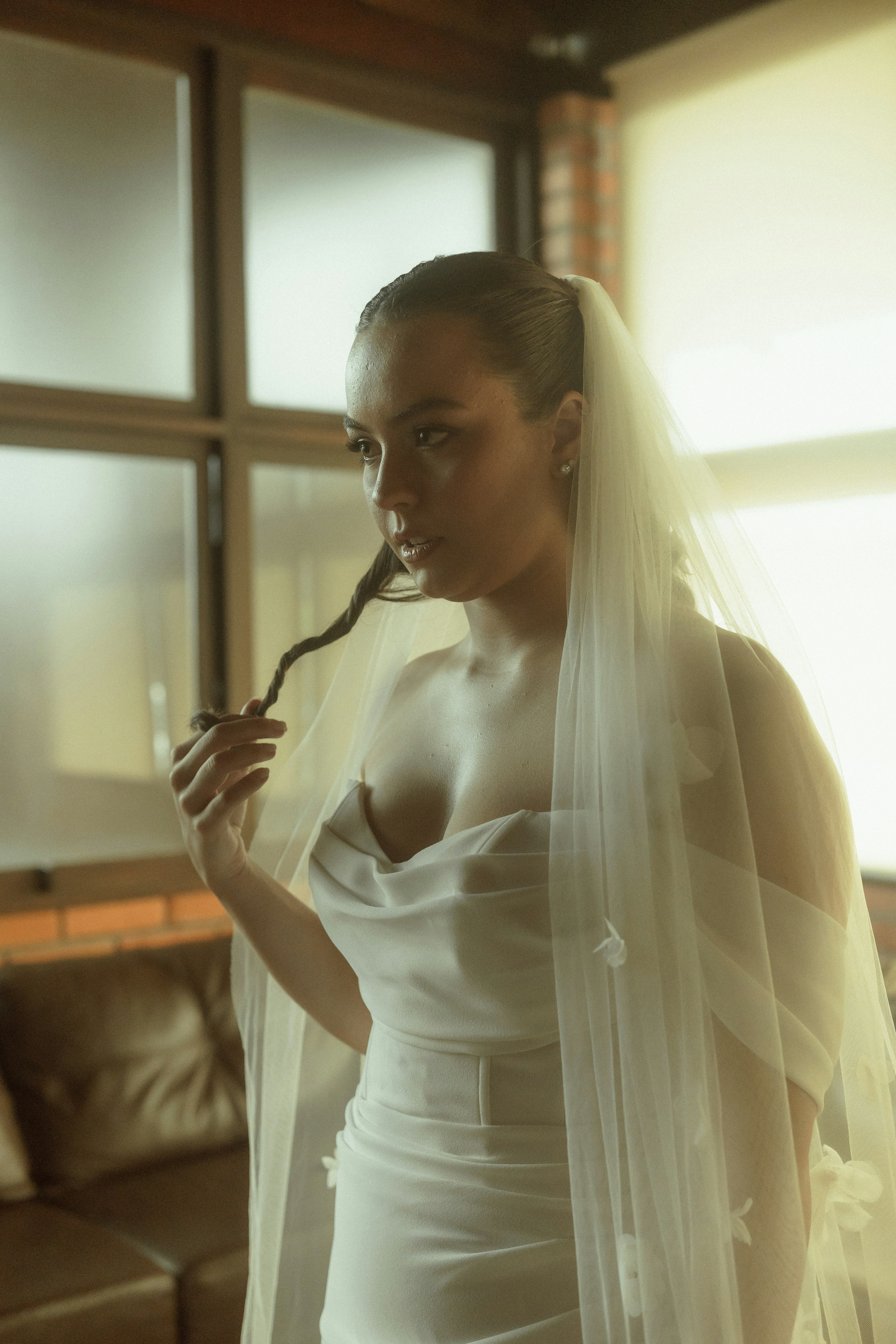 Bride in a white dress with veil touches of elegance