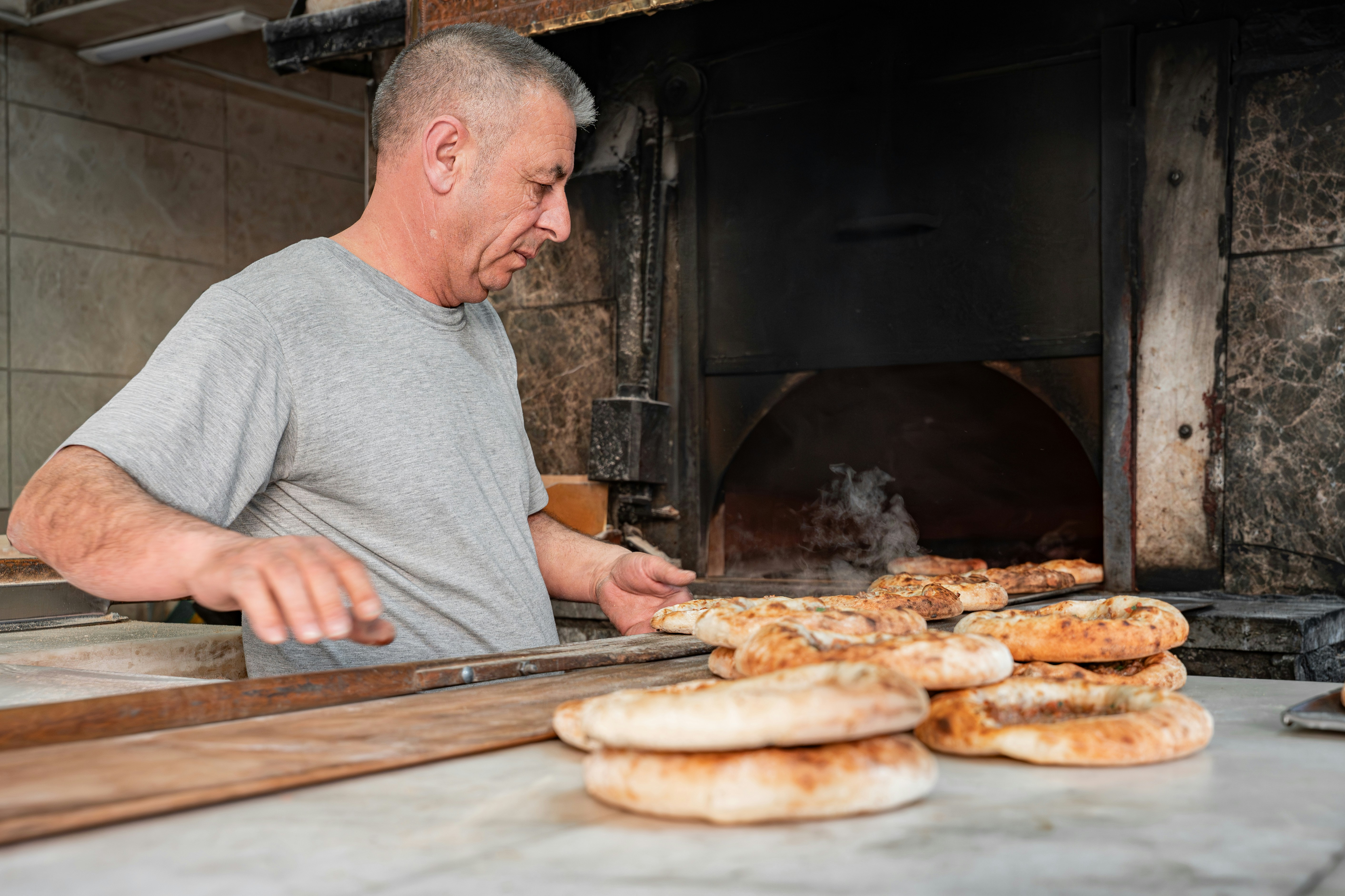 Turkish pide flatbread from wood fired oven family dinner Turkey holiday Indian travellers
