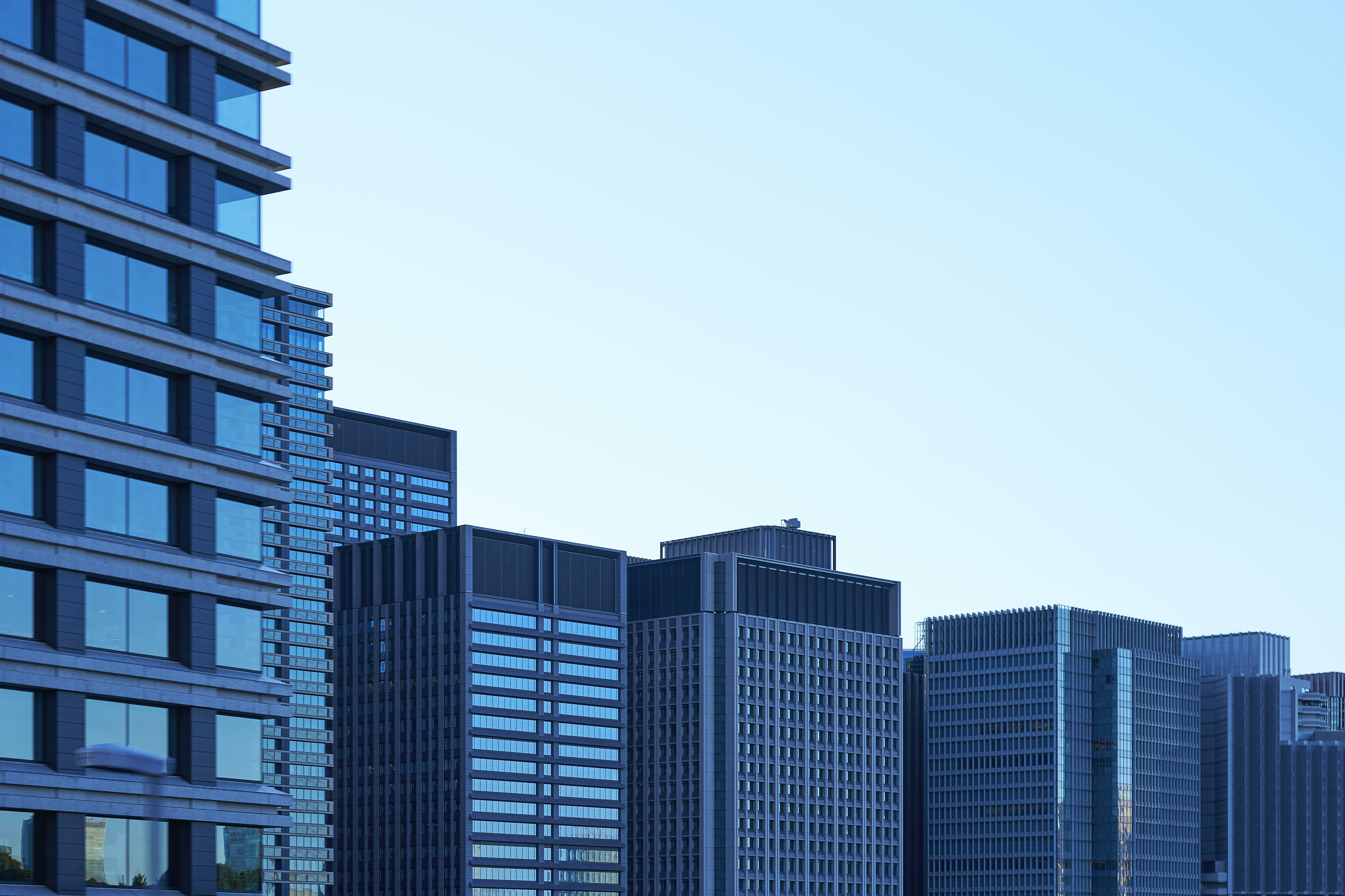 A minimalist urban landscape that pushes the functional beauty of architecture to its limit. The beautiful patterns created by the inorganic structures are ideal as visuals symbolizing IT, technology, and digital transformation.