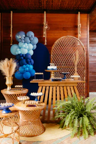 Dessert table with balloons and cake for 70th birthday.
