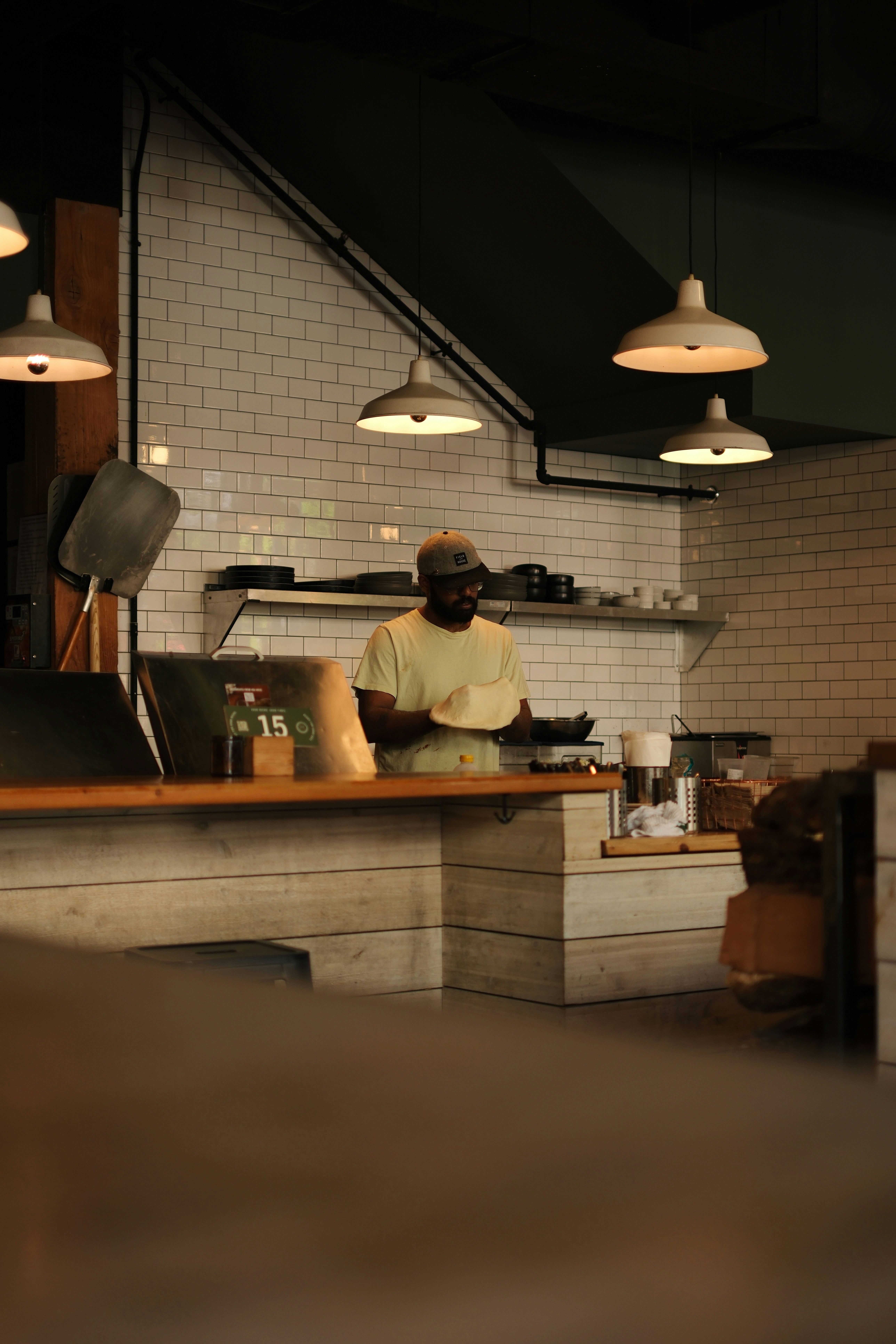 A person working in a brightly lit kitchen.