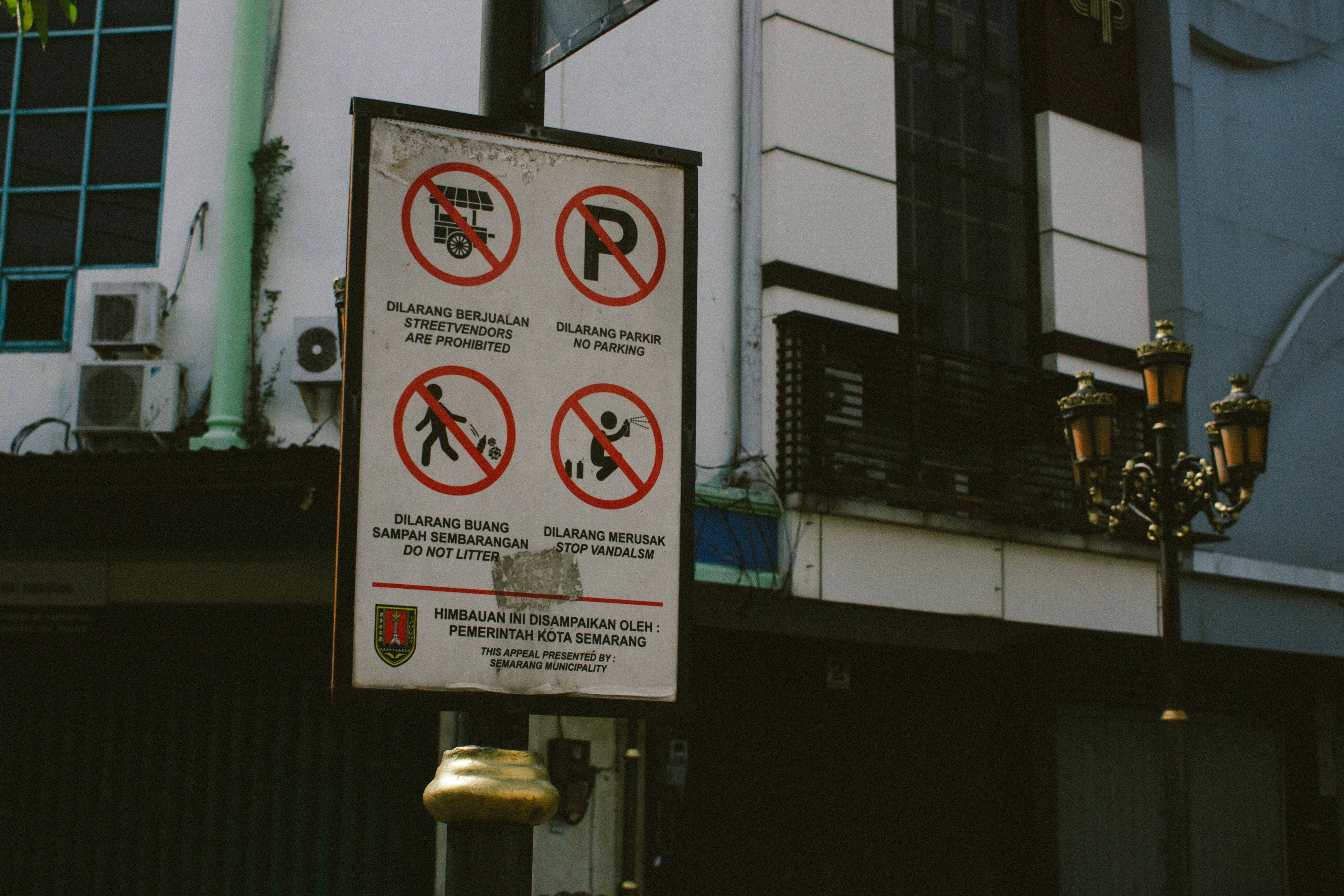 A sign with four no-symbols and text.
