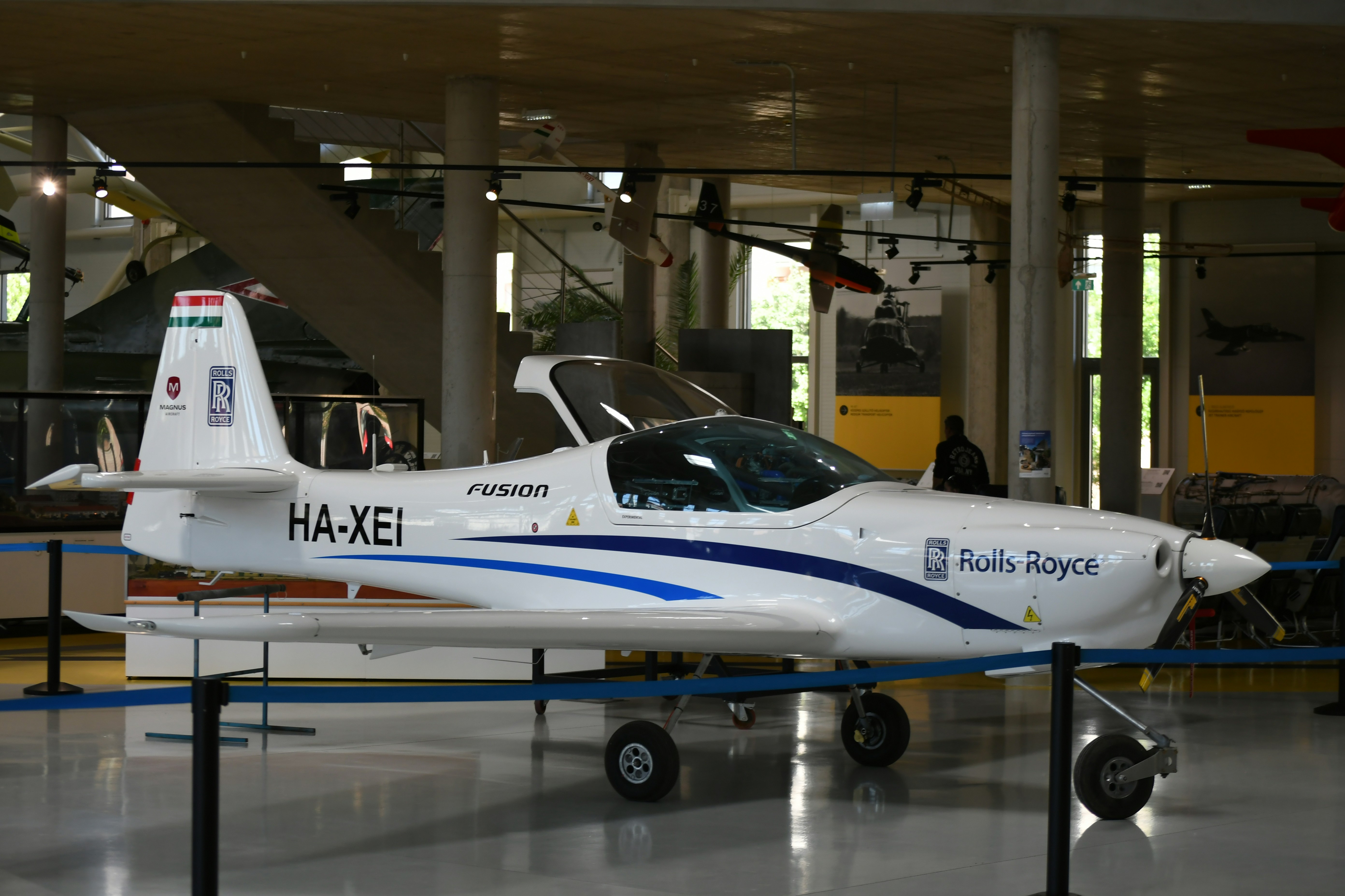 White airplane with blue stripes and ha-xei