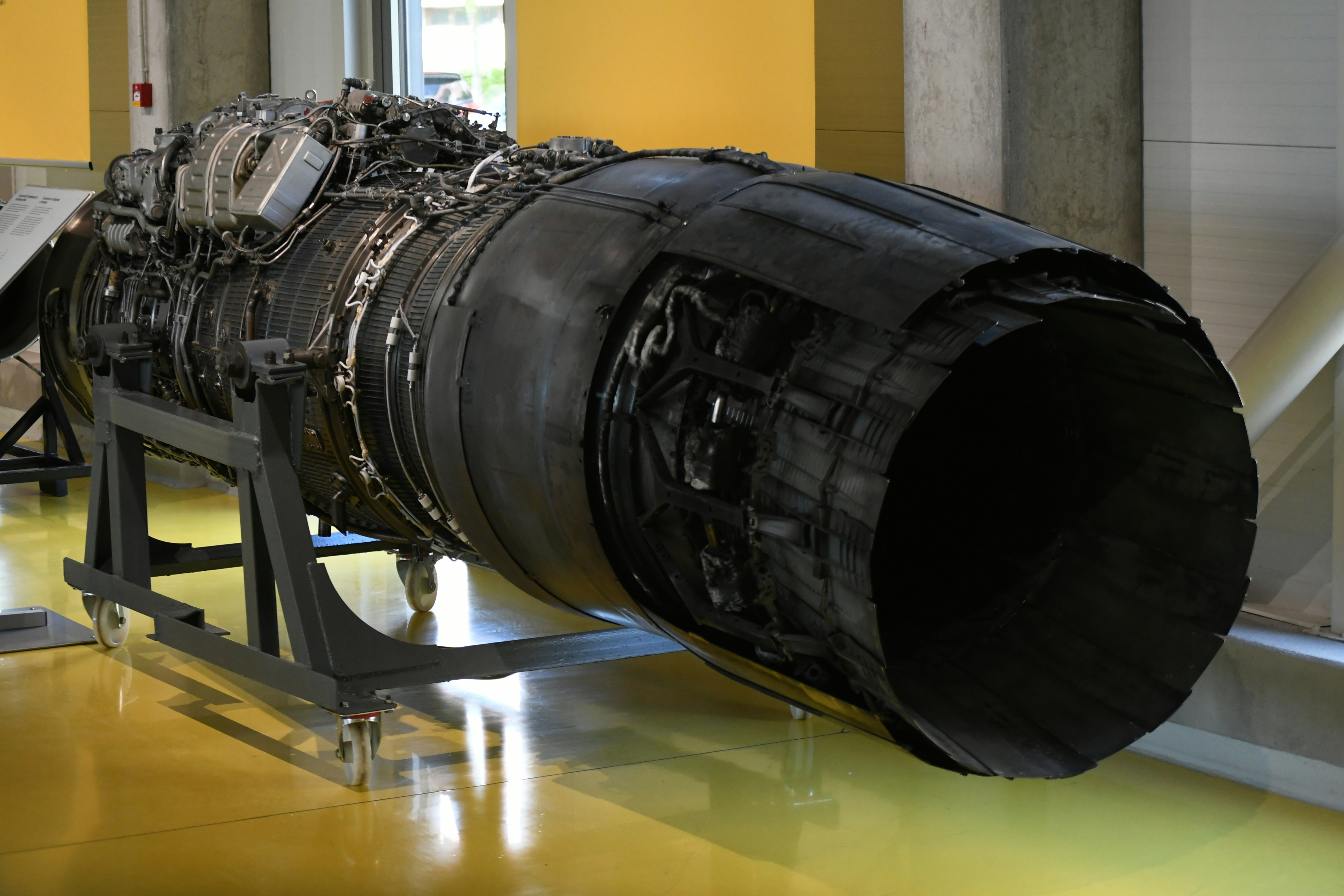 A large jet engine on display stands
