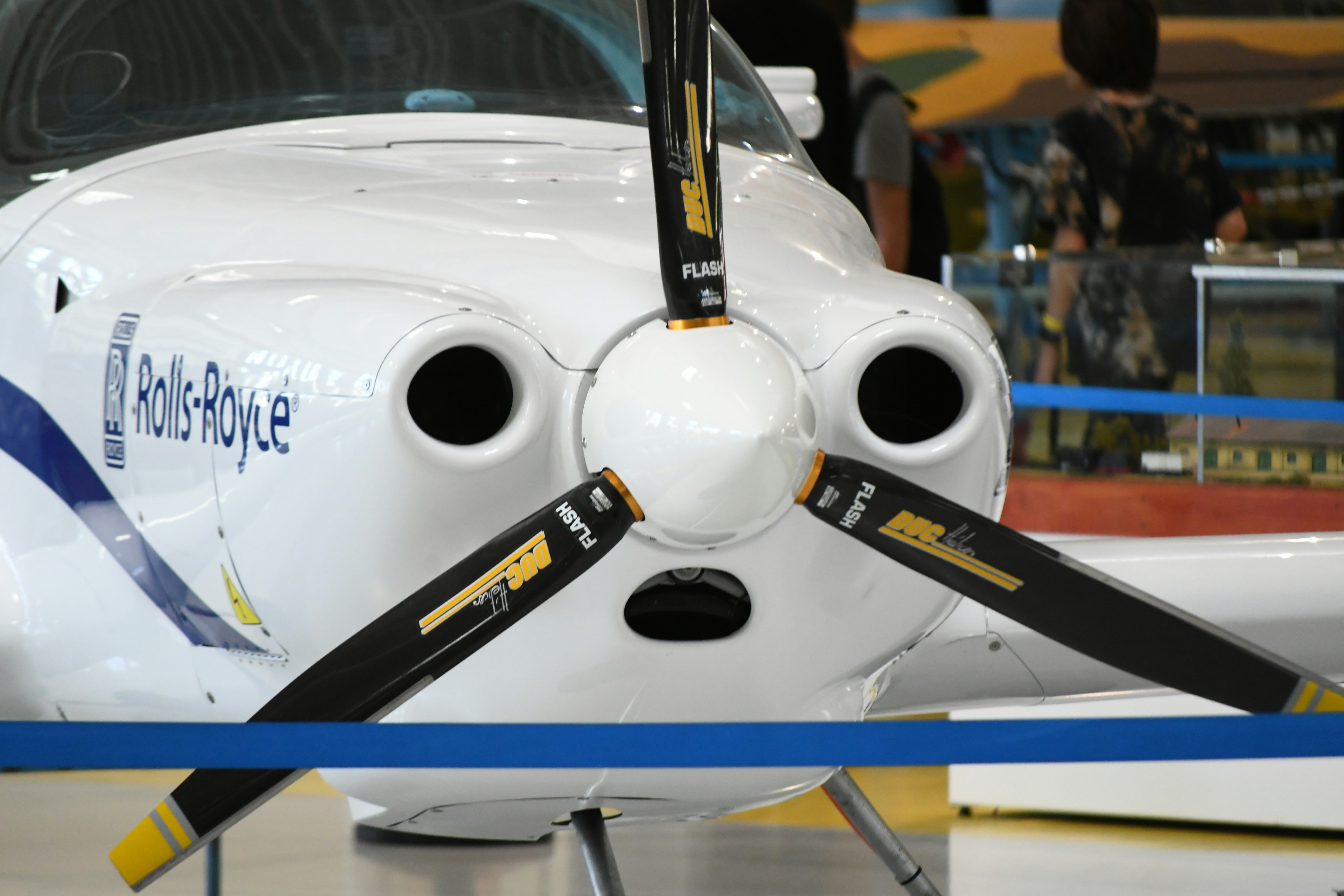 Close-up of a white rolls-royce airplane propeller.