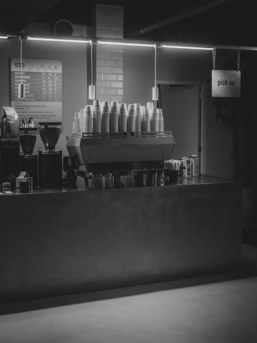 A café counter with an espresso machine