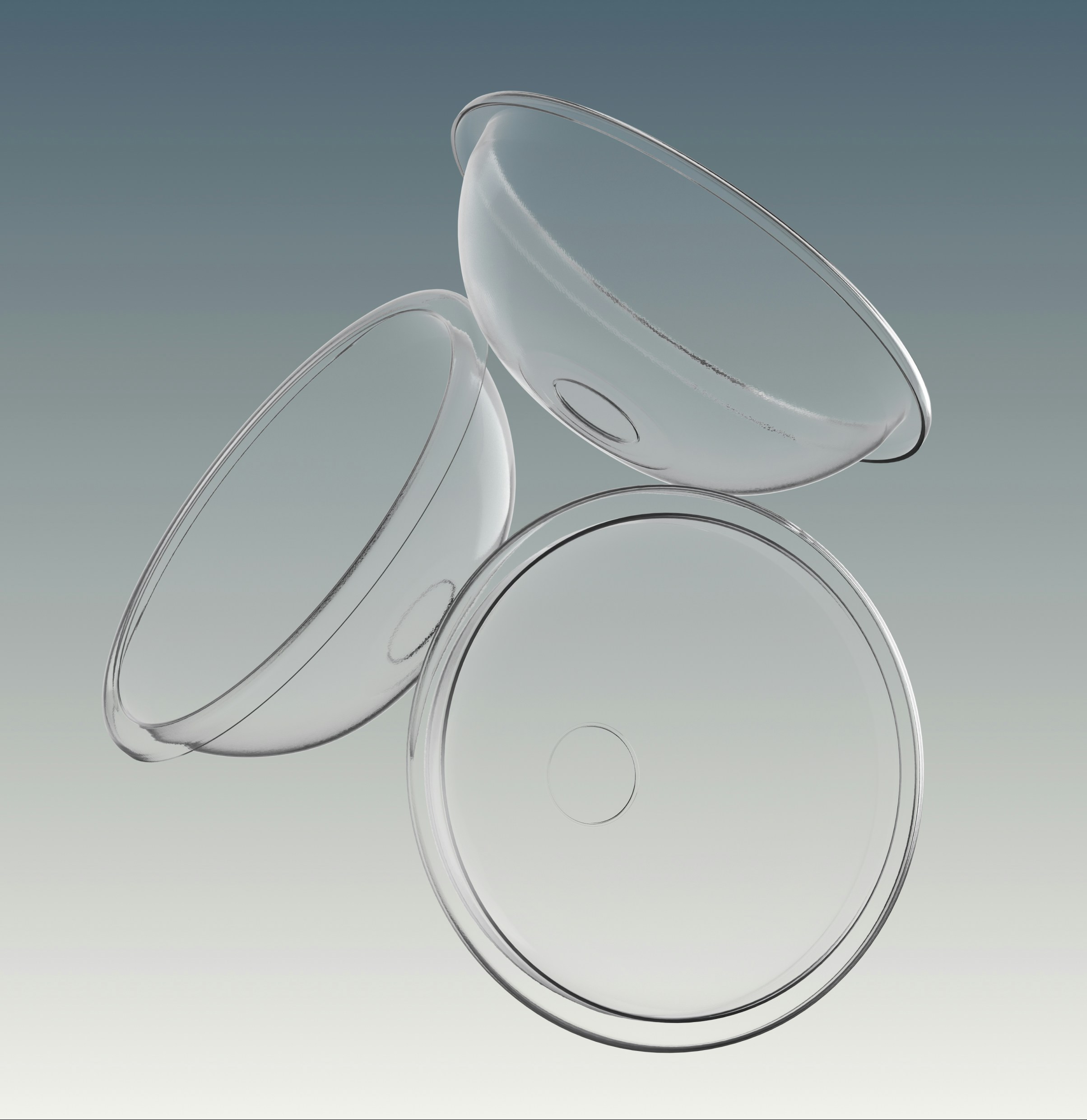 Three clear plastic petri dishes on a gradient background