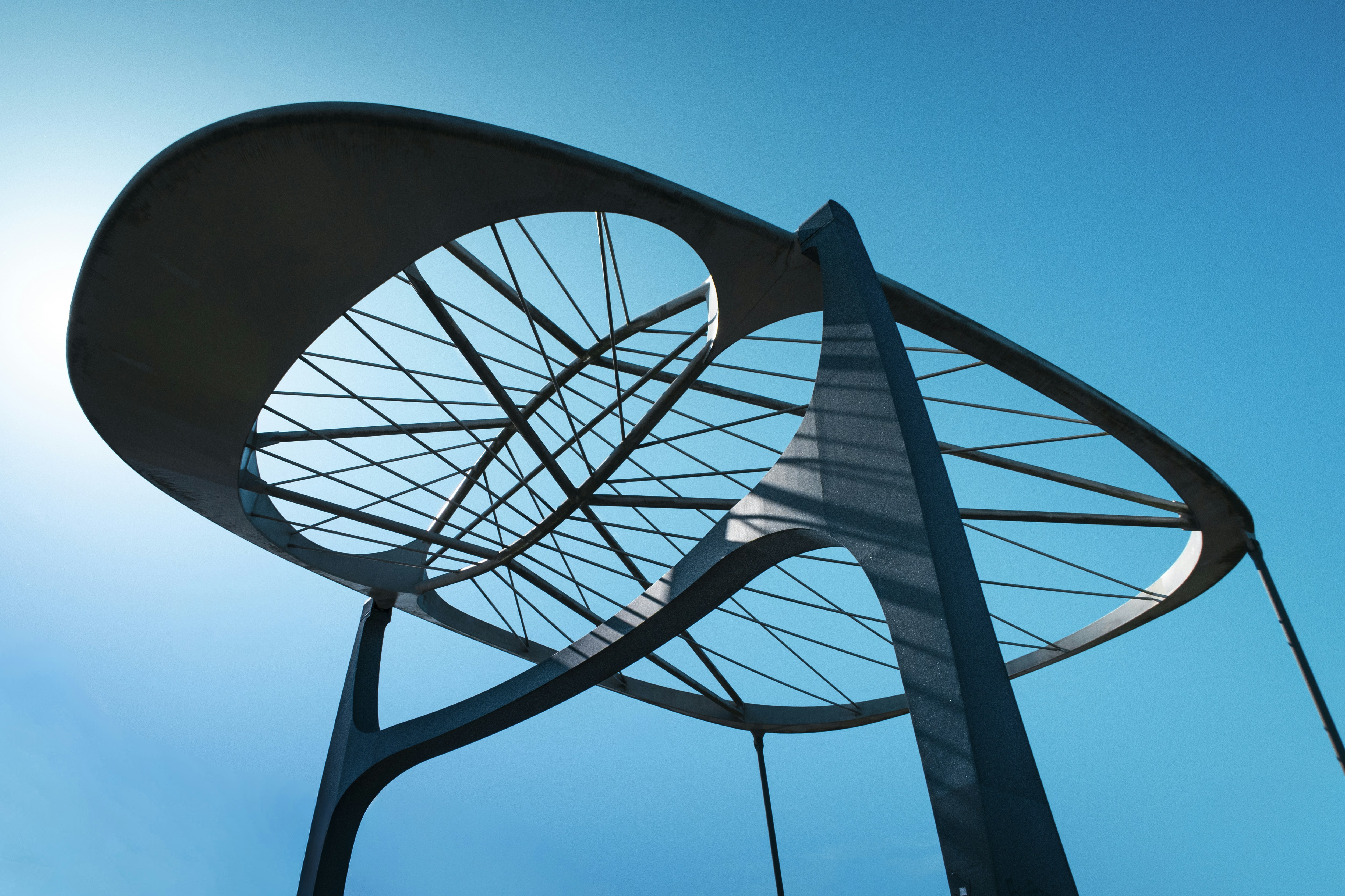 Modern sculpture against a bright blue sky