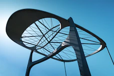 Modern sculpture against a bright blue sky