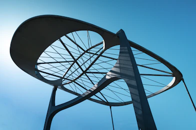 Modern sculpture against a bright blue sky