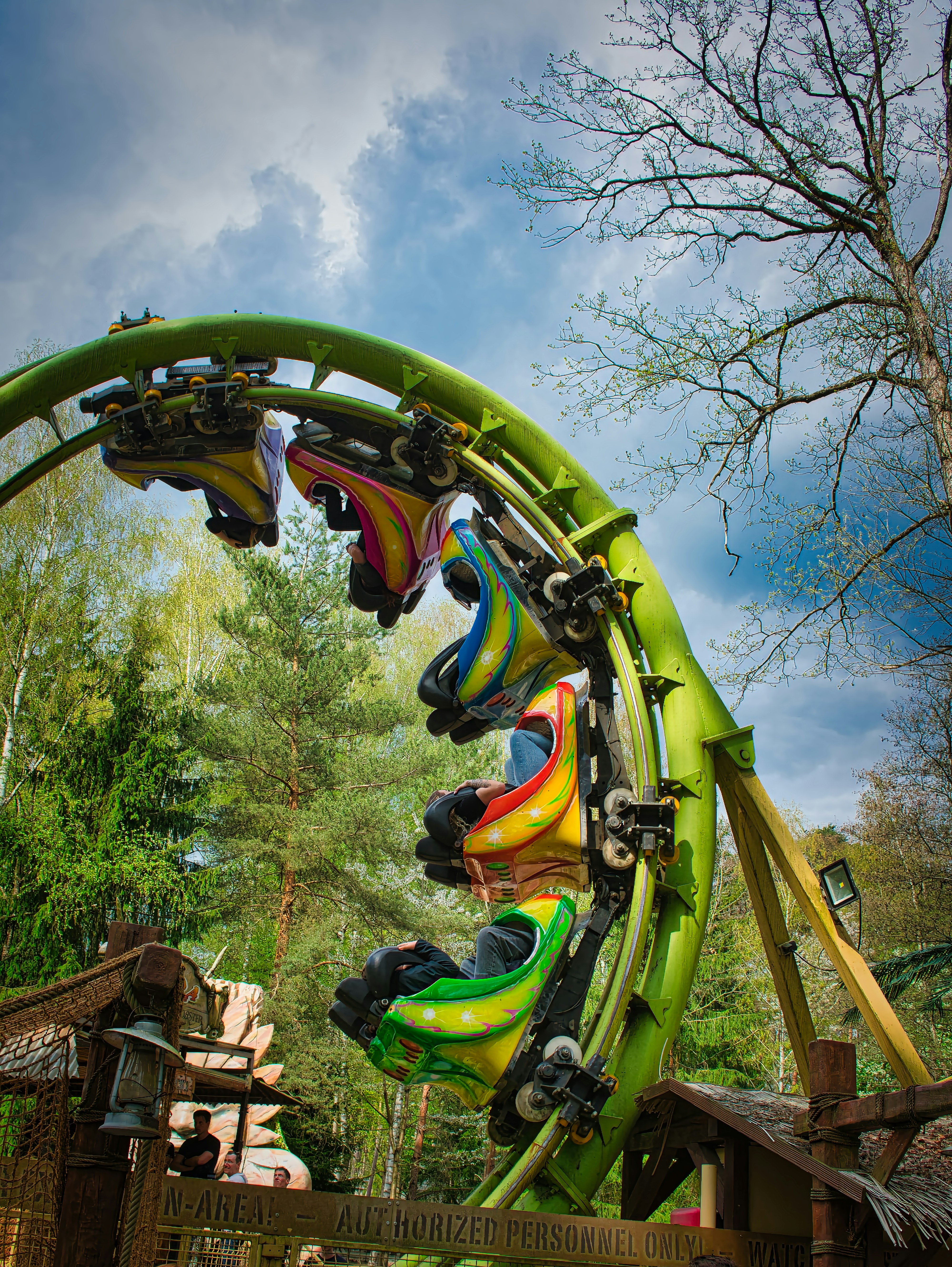 Roller coaster cars on a steel loop track