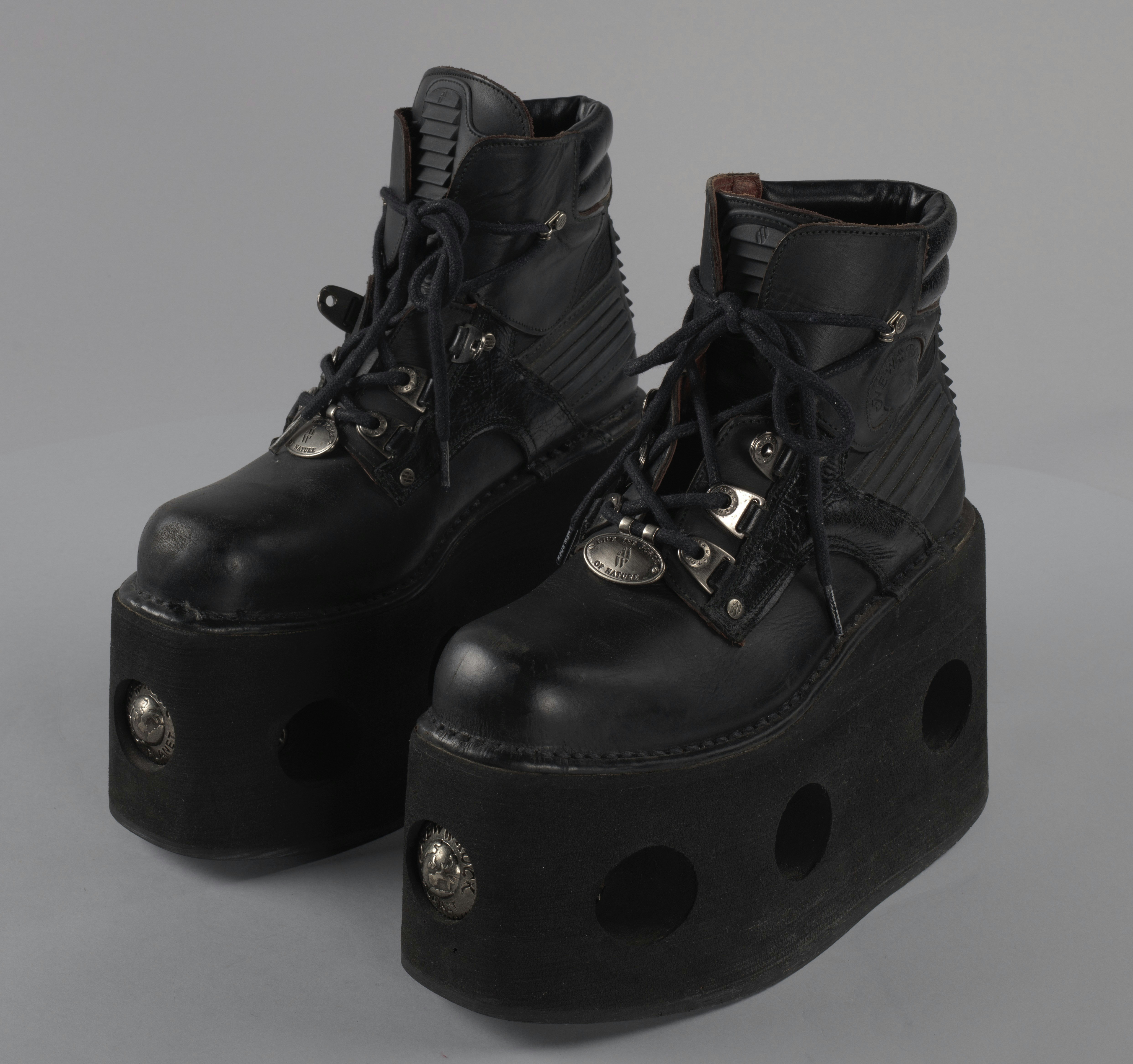 Manufactured by: New Rock, Worn by: Bootsy Collins, Date: 1990, Medium: leather, rubber, metal, and cotton cord shoelaces with plastic aglets Record ID: nmaahc_2015.234.2.4ab
