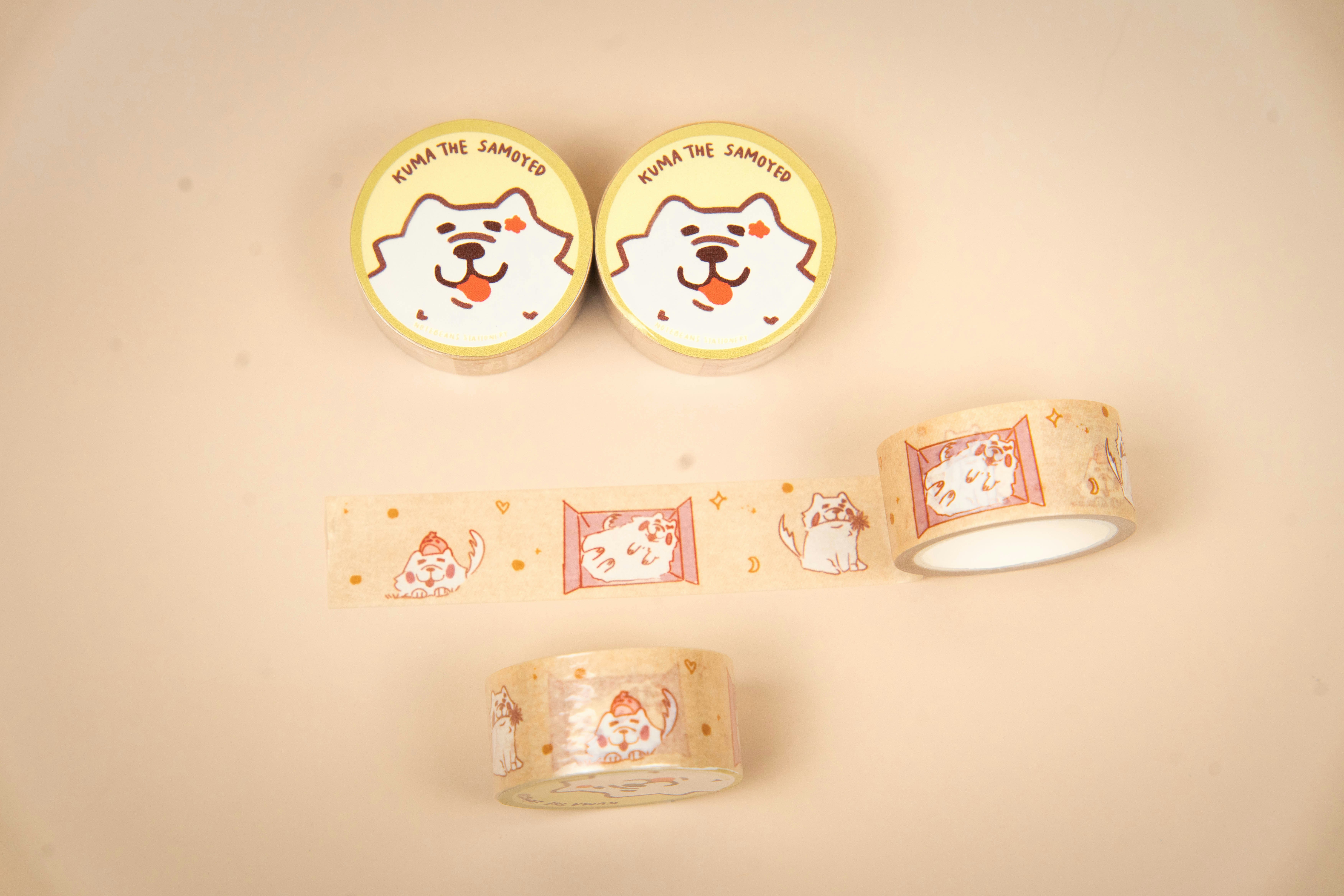 Two rolls of tape with dog faces