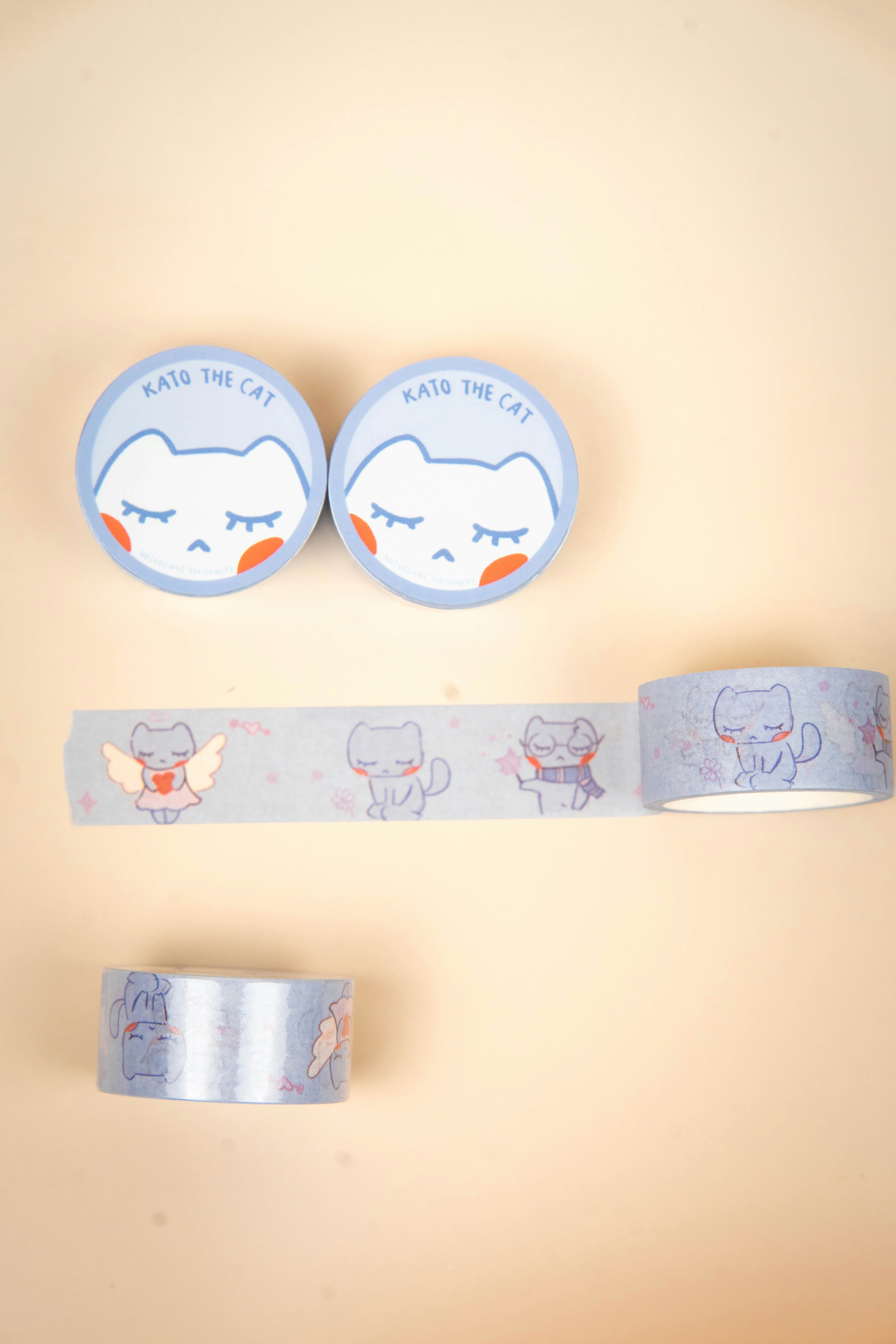 Two rolls and tape with cat illustrations