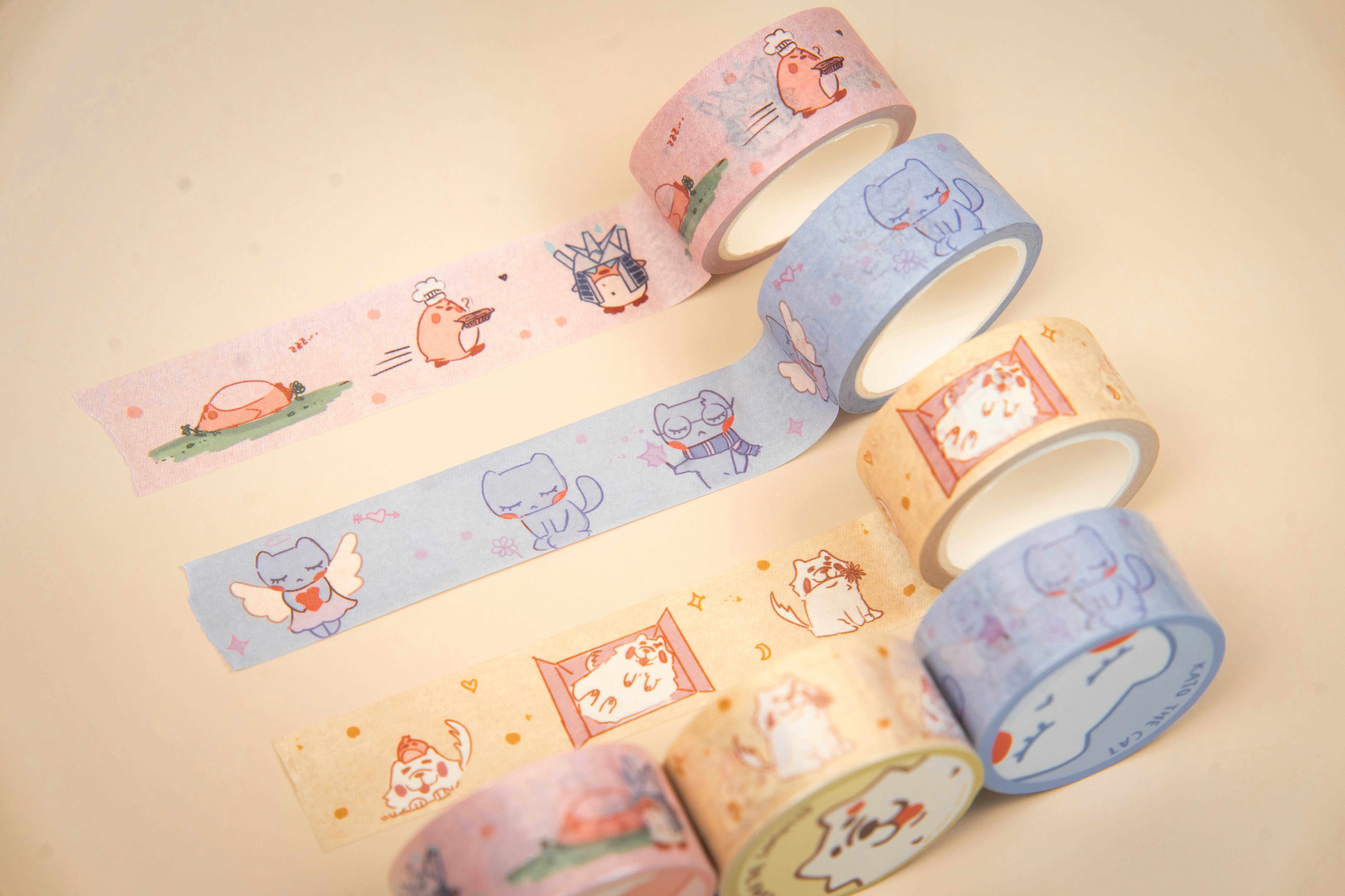 Assortment of decorative washi tapes with cute animal designs.