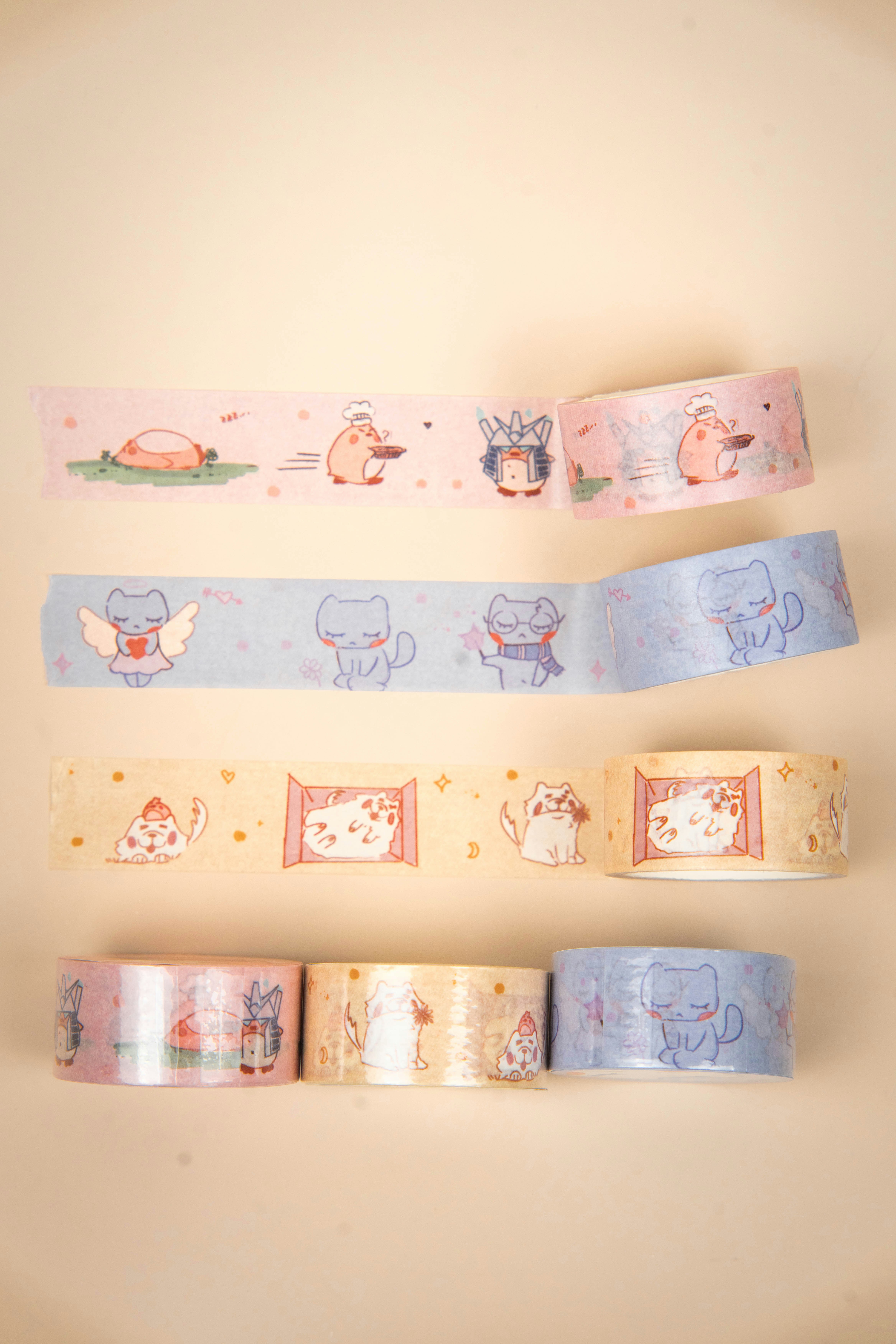 Rolls of decorative tape with cute cat designs.